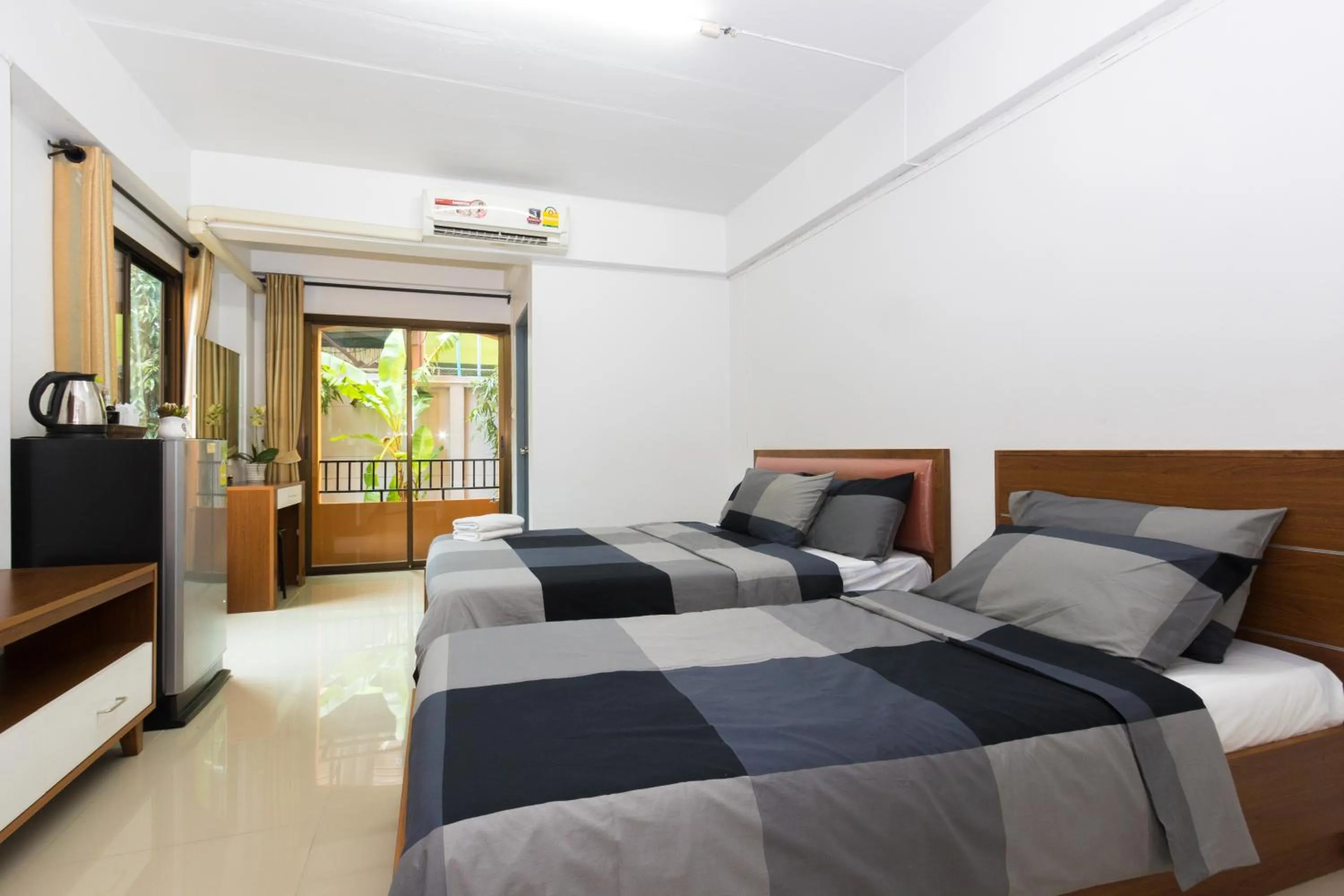 Bed in I-Home Residence and Hotel