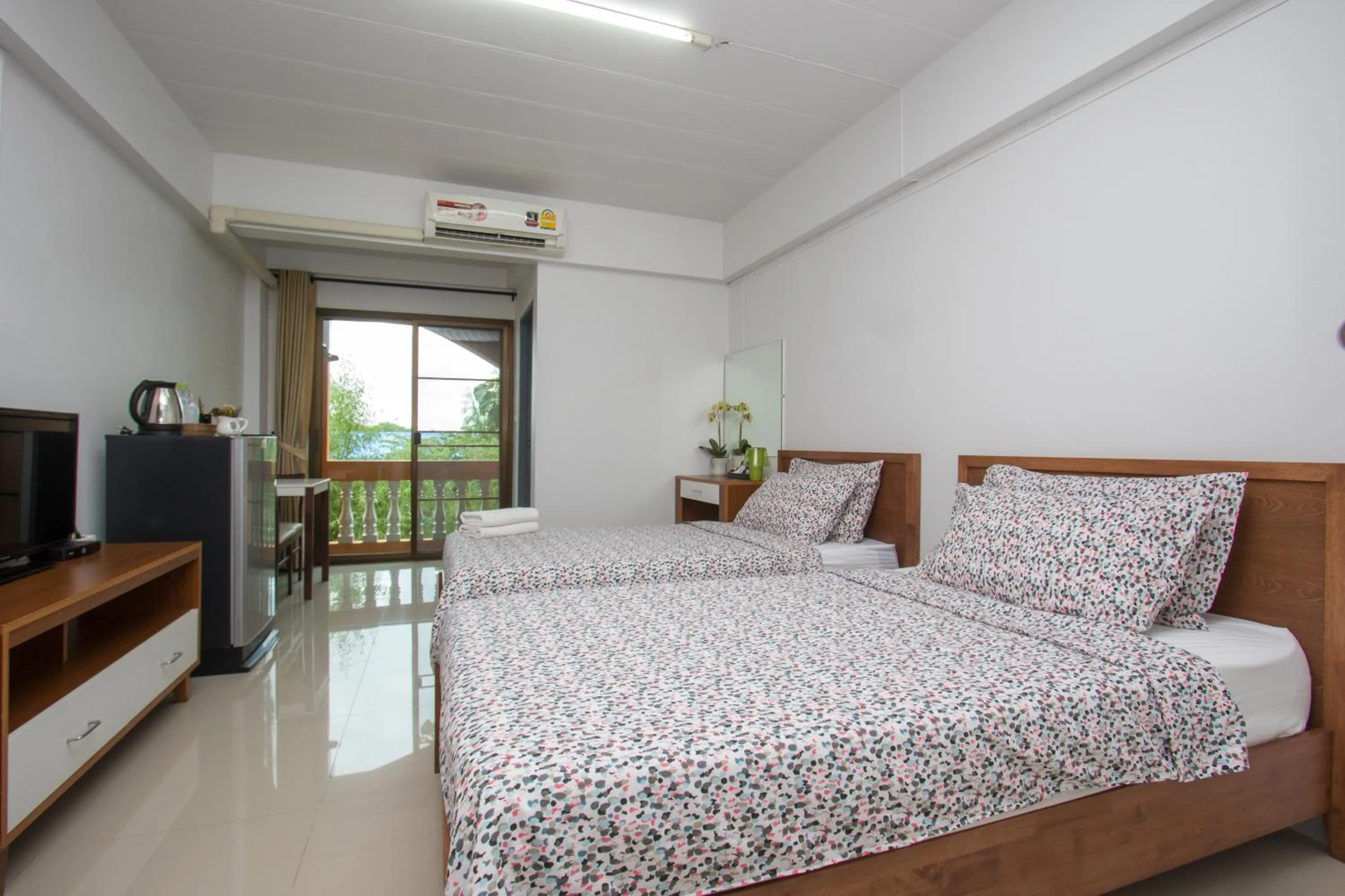 Bed in I-Home Residence and Hotel