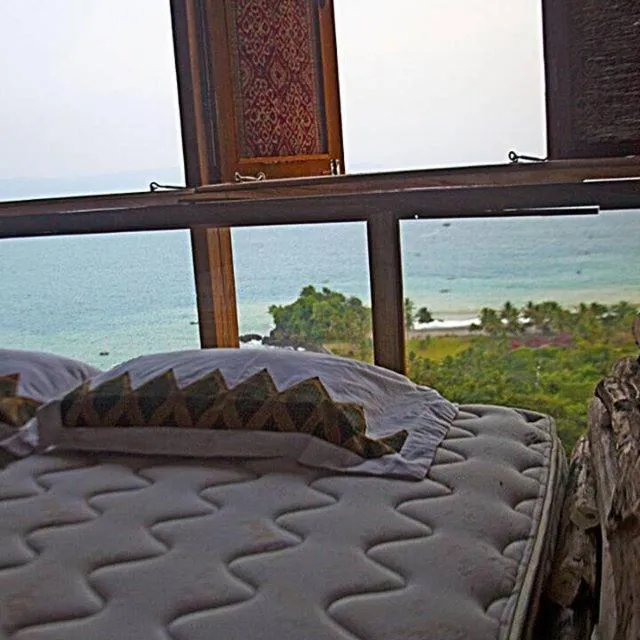 Bed in Karang Aji Beach Villa
