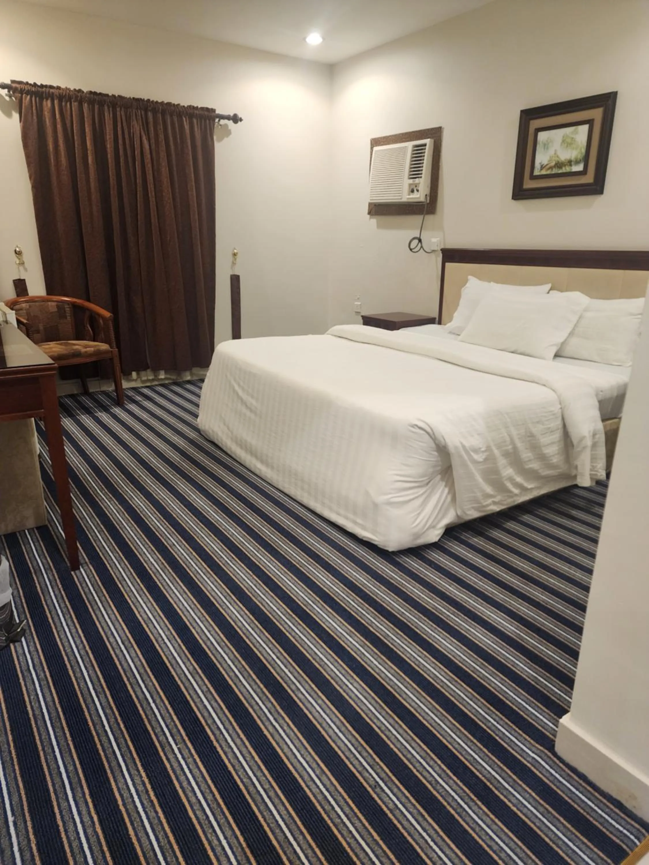 Bed in Makarim Palm Hotel