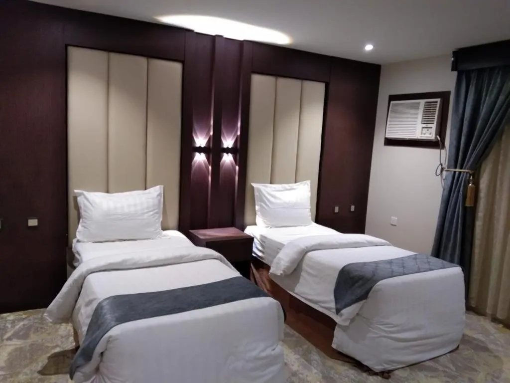 Bed in Makarim Palm Hotel