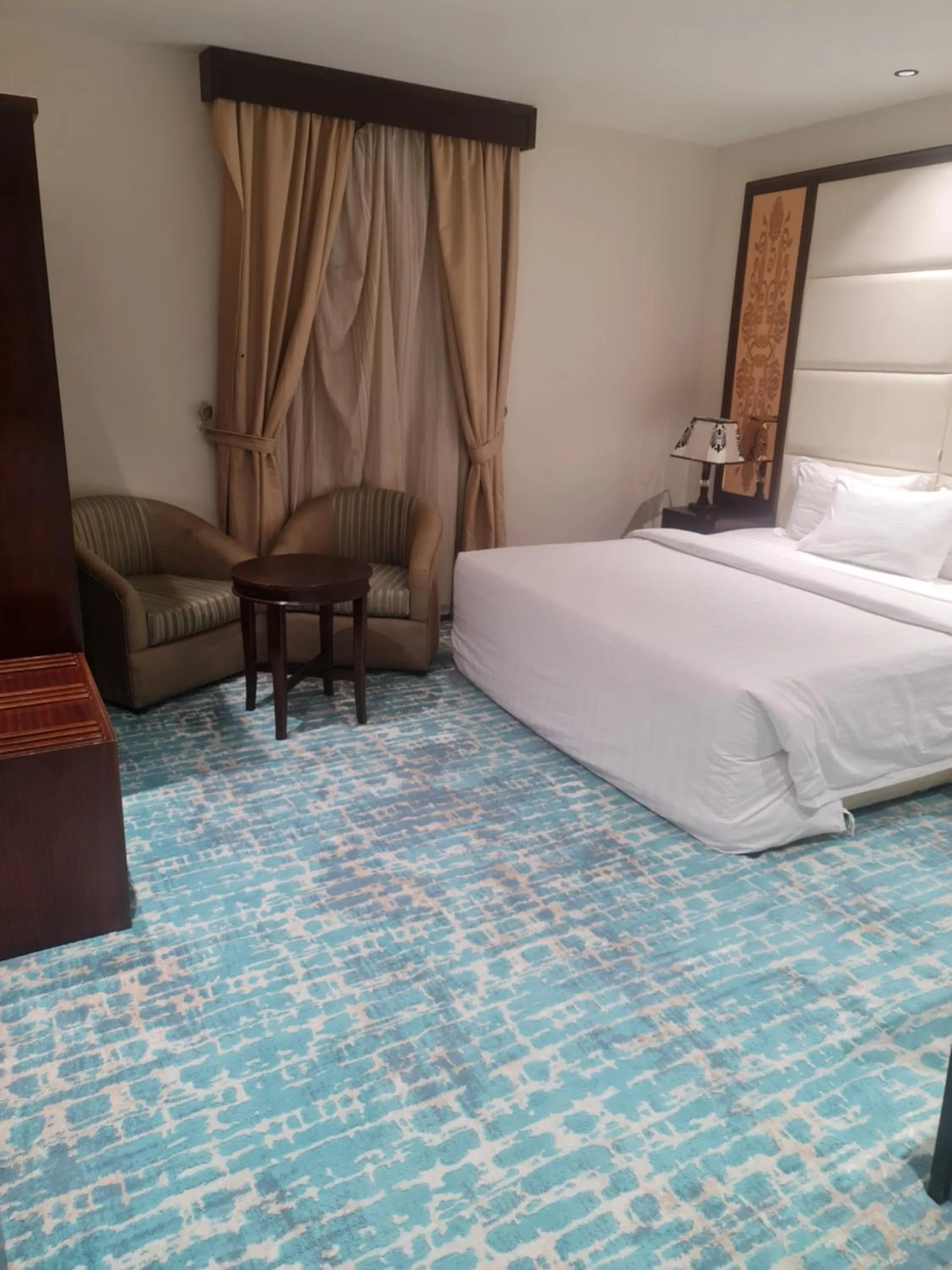 Bed in Makarim Palm Hotel