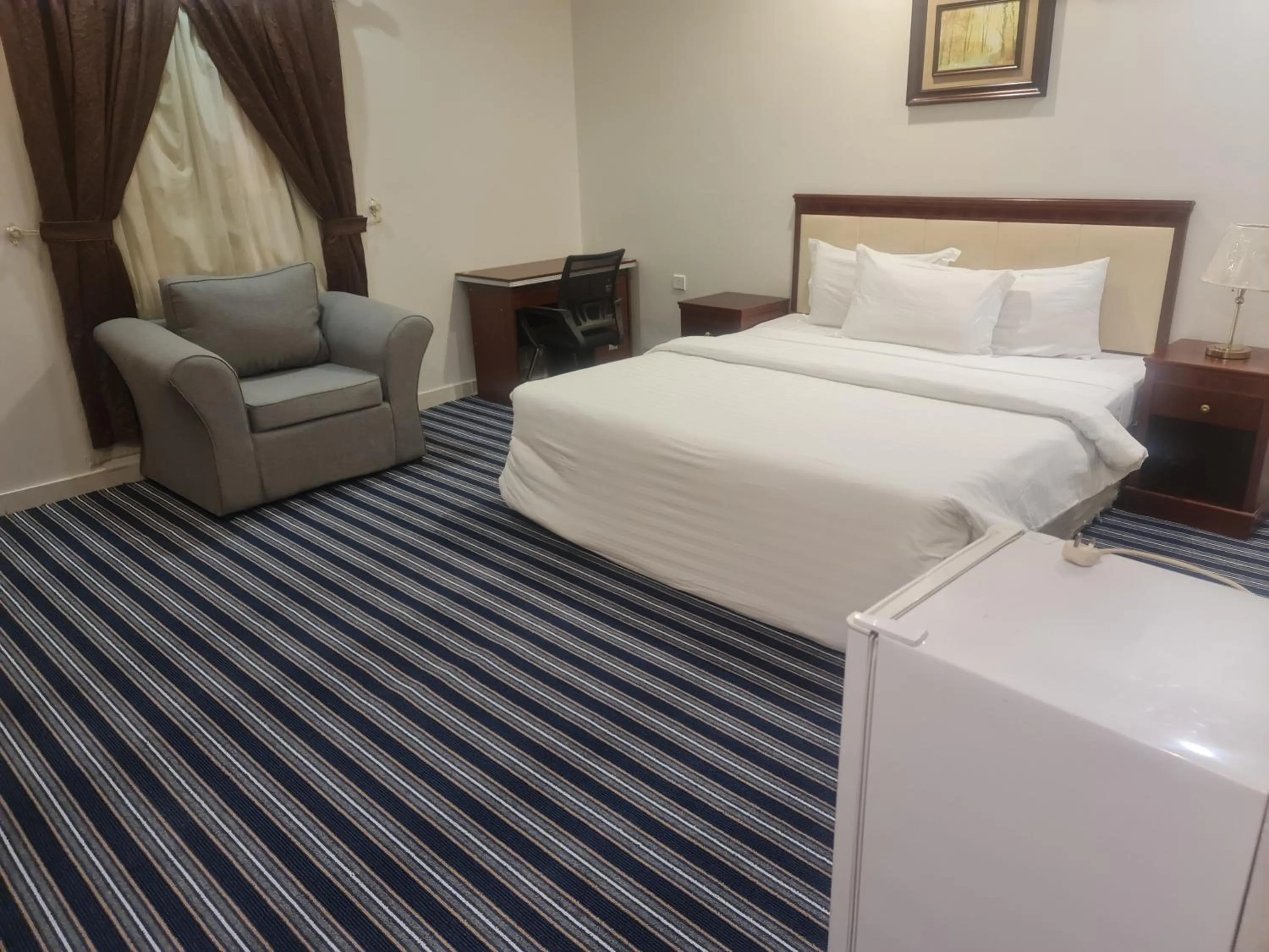 Bed in Makarim Palm Hotel