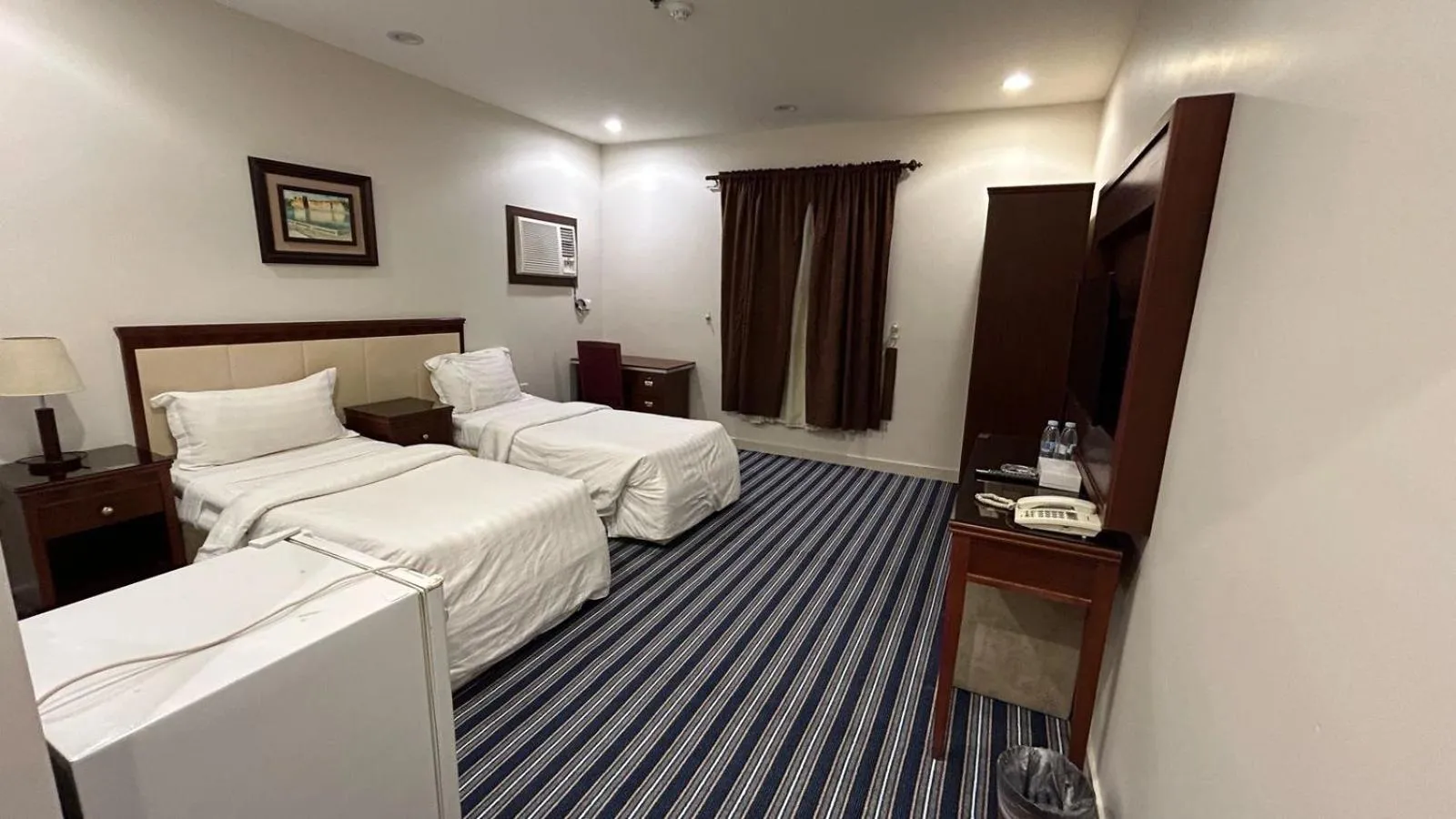 Bed in Makarim Palm Hotel