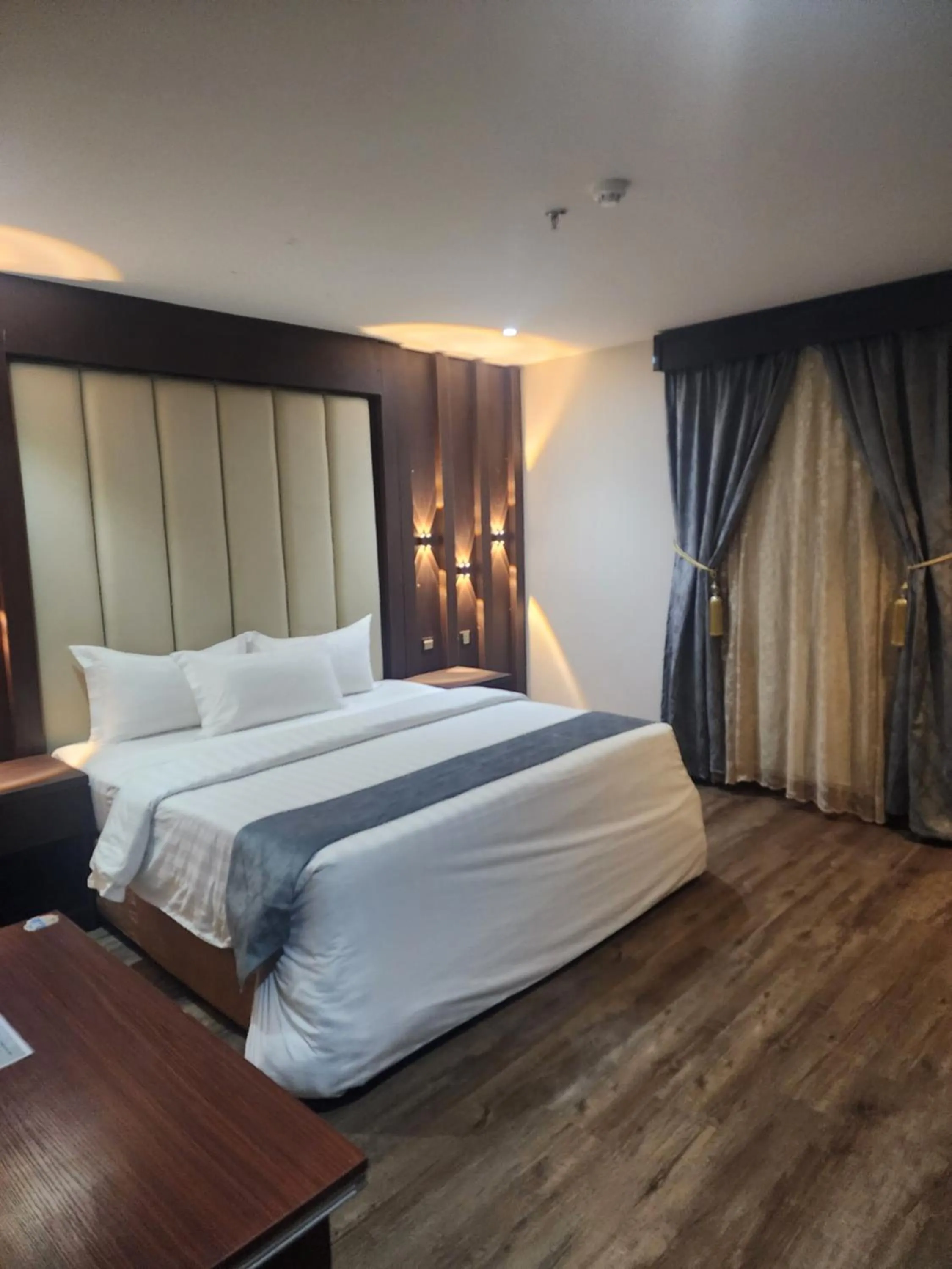 Bed in Makarim Palm Hotel