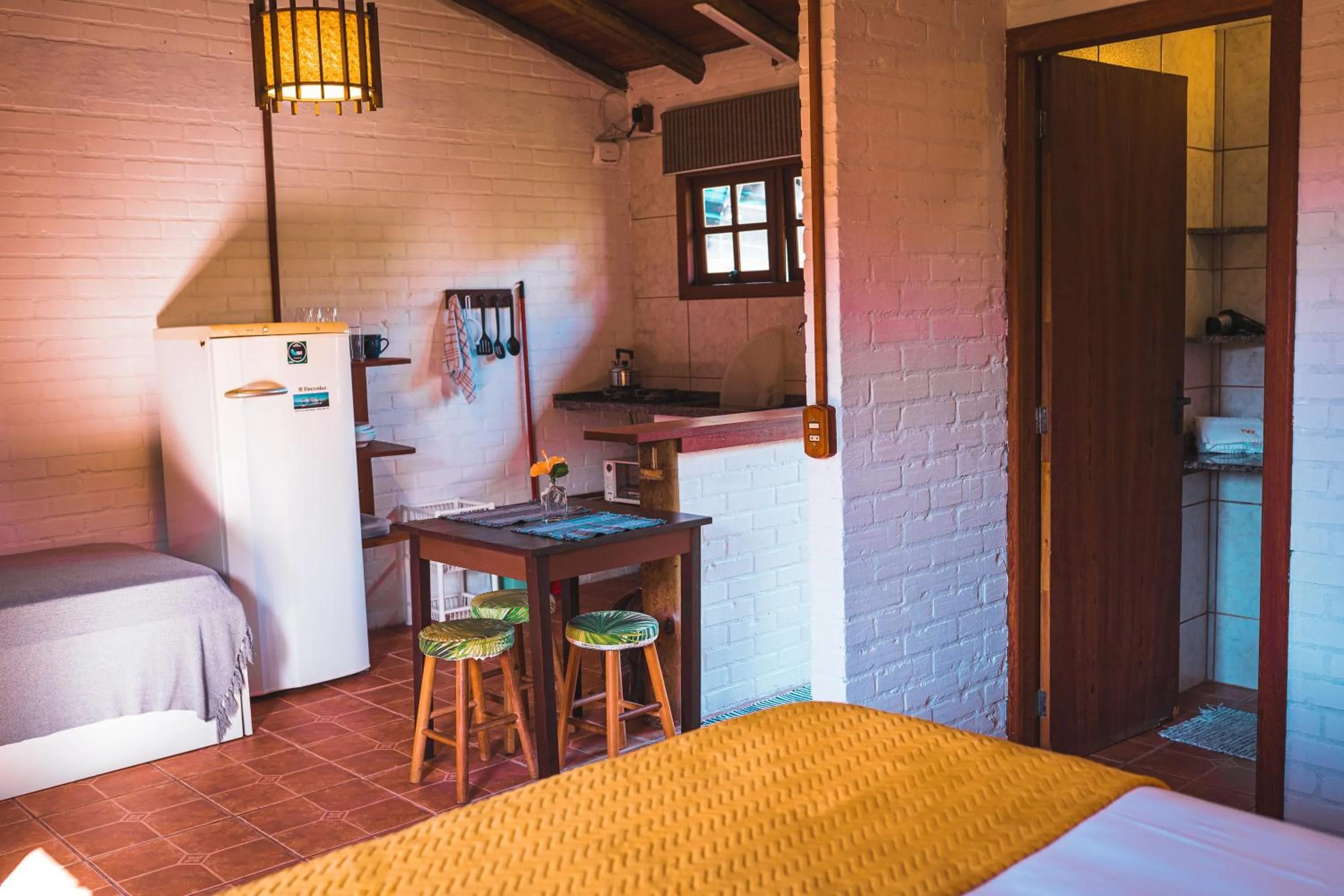 Kitchen or kitchenette, Bed in Pousada Villa Seychelles