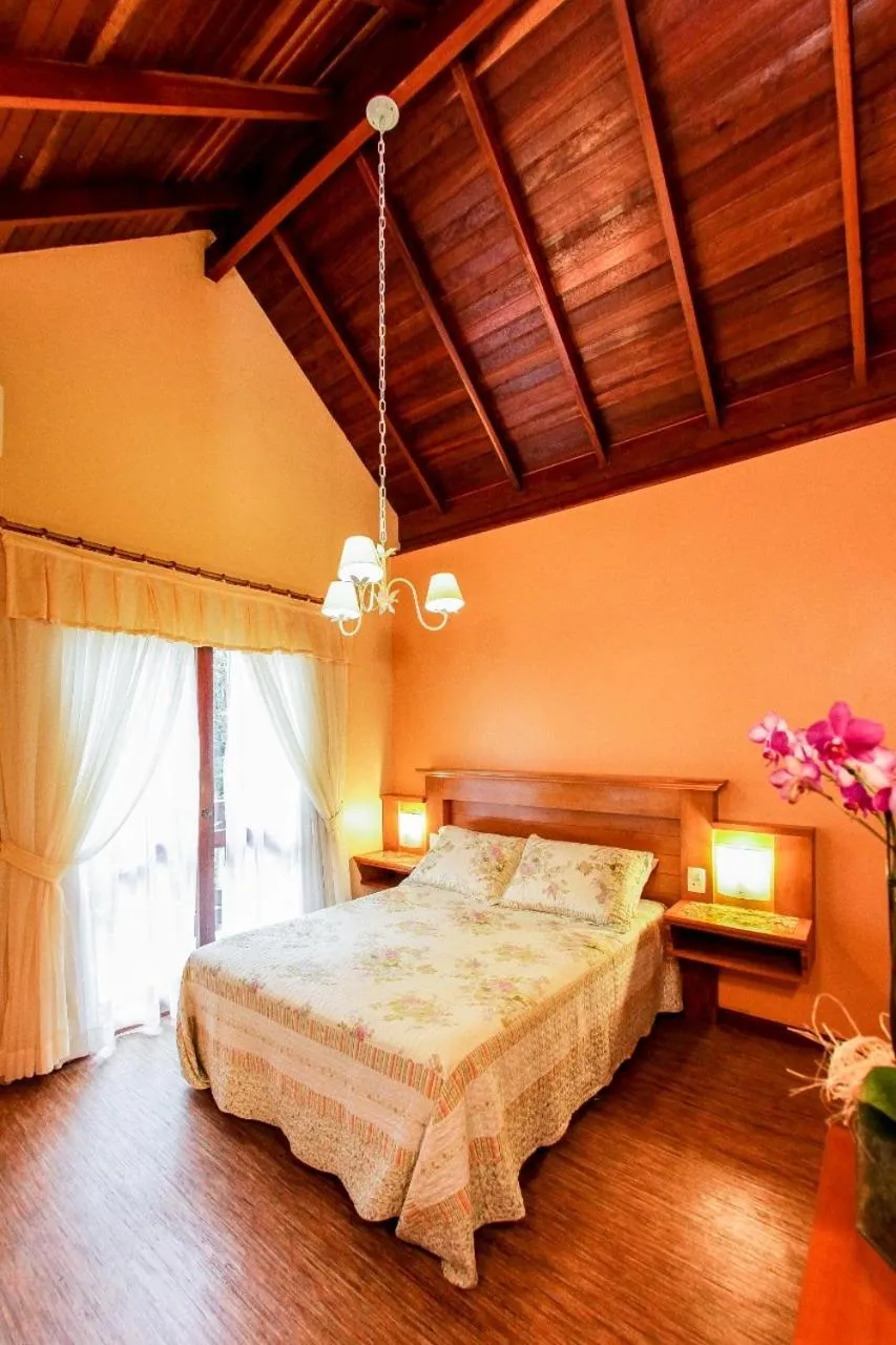 Bed in Pousada Das Papoulas