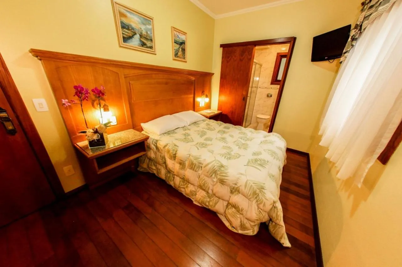 Bed in Pousada Das Papoulas