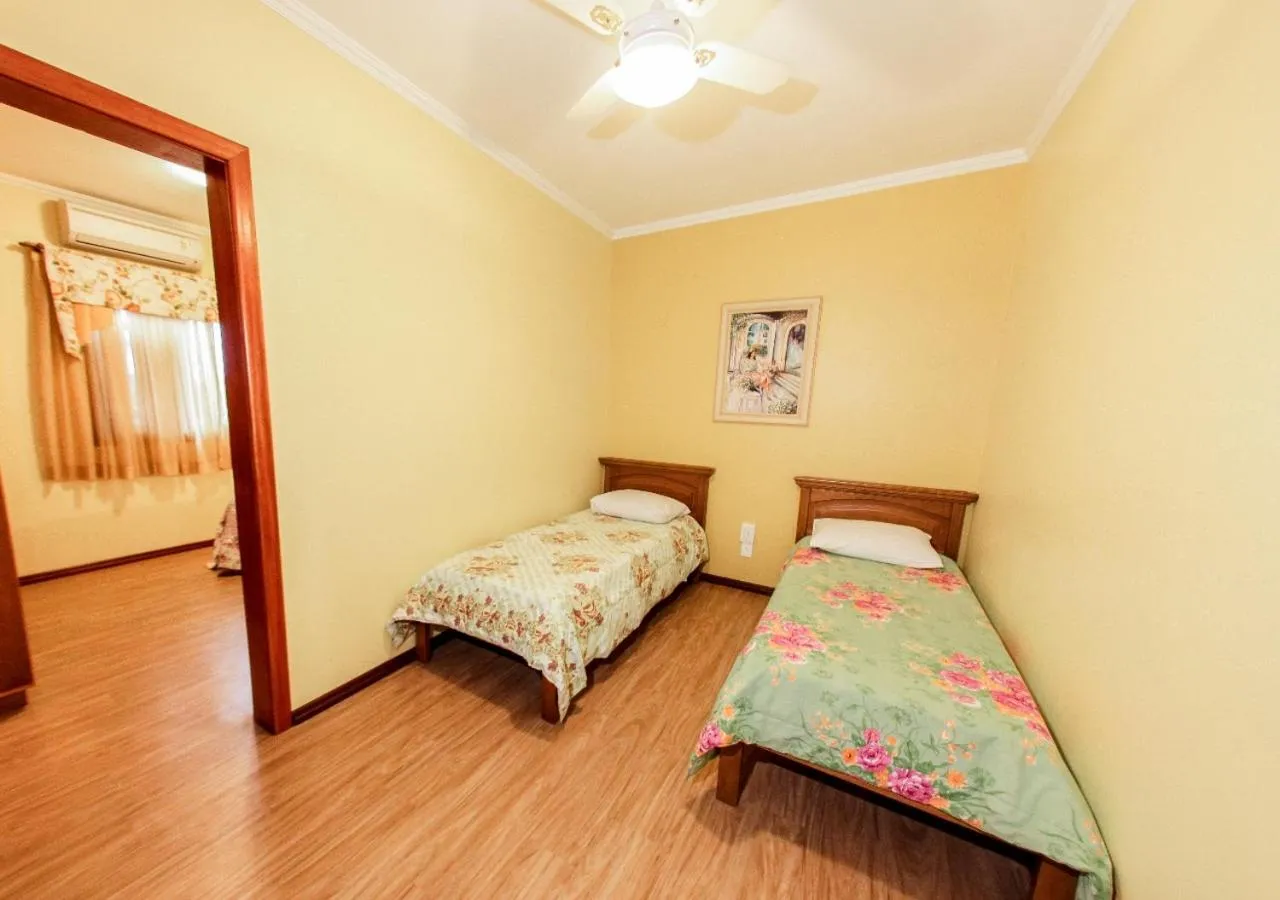 Bed in Pousada Das Papoulas