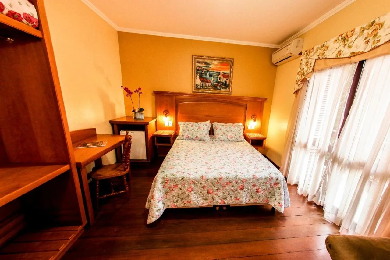 Bed in Pousada Das Papoulas