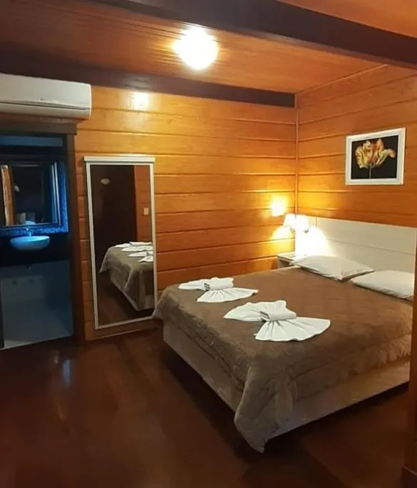 Bed in Pousada Das Papoulas