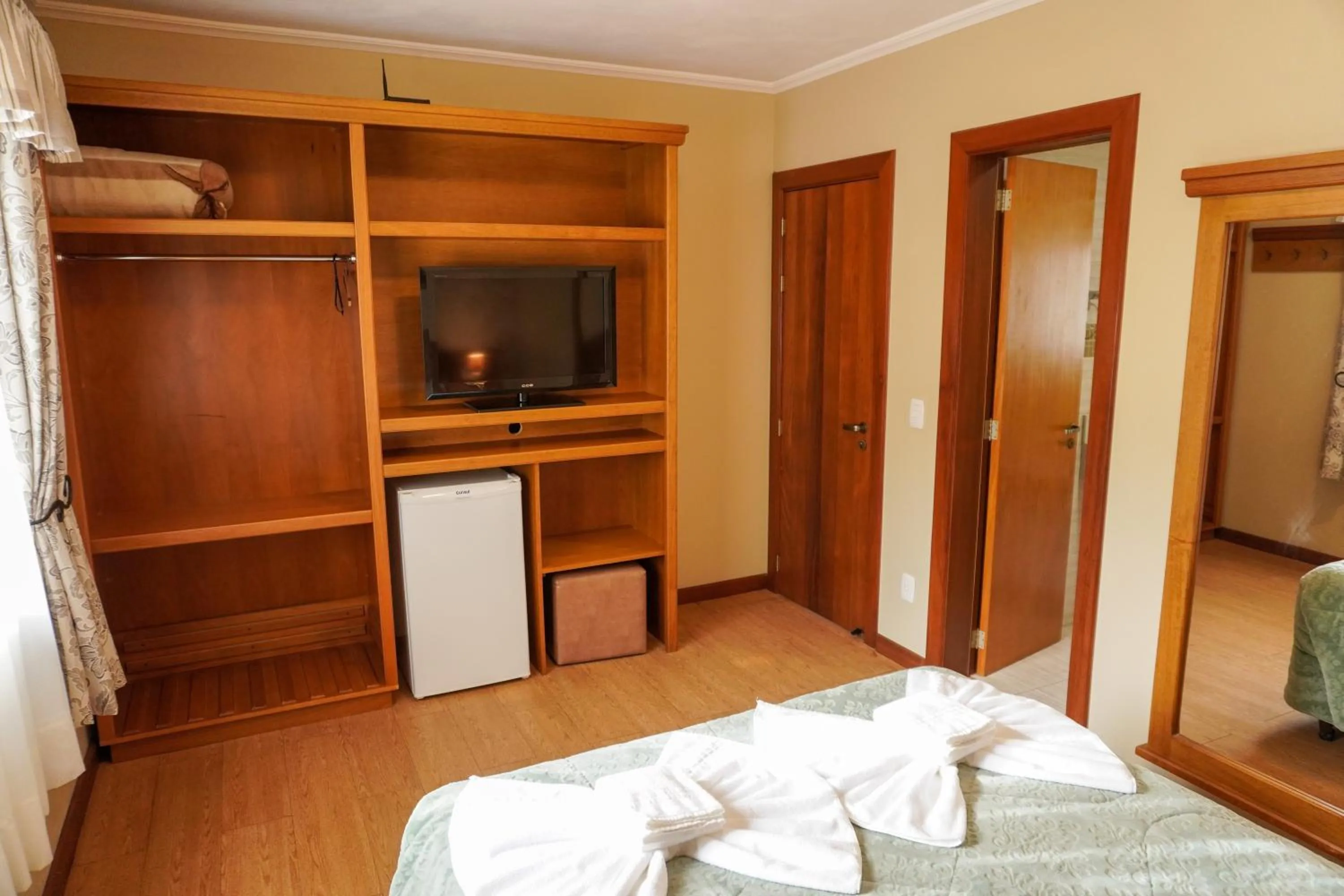 Bed in Pousada Das Papoulas