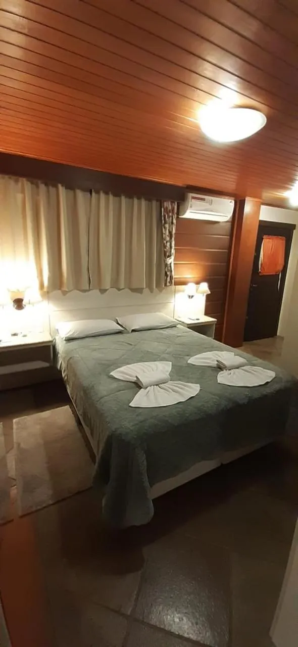 Bed in Pousada Das Papoulas