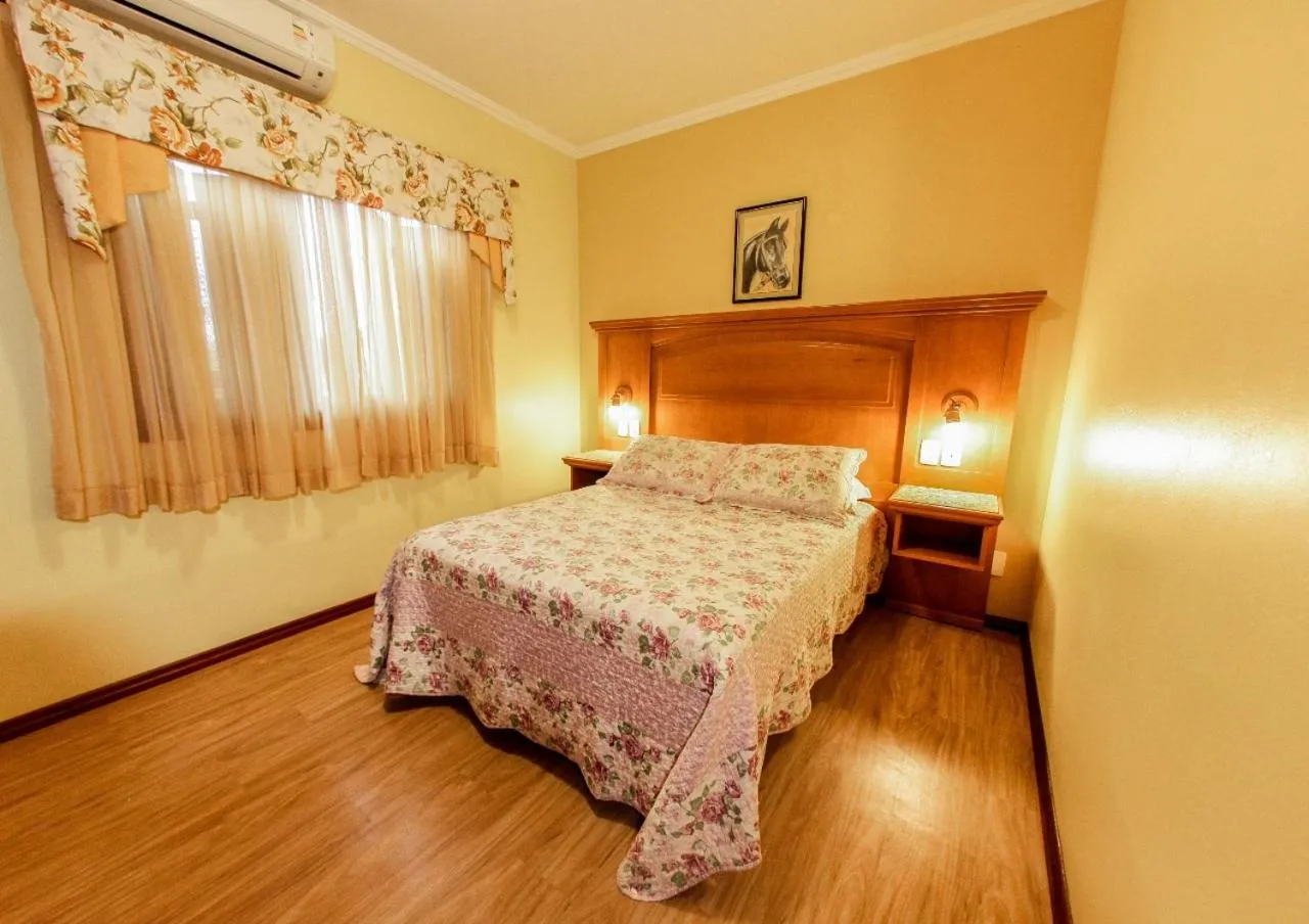 Bed in Pousada Das Papoulas