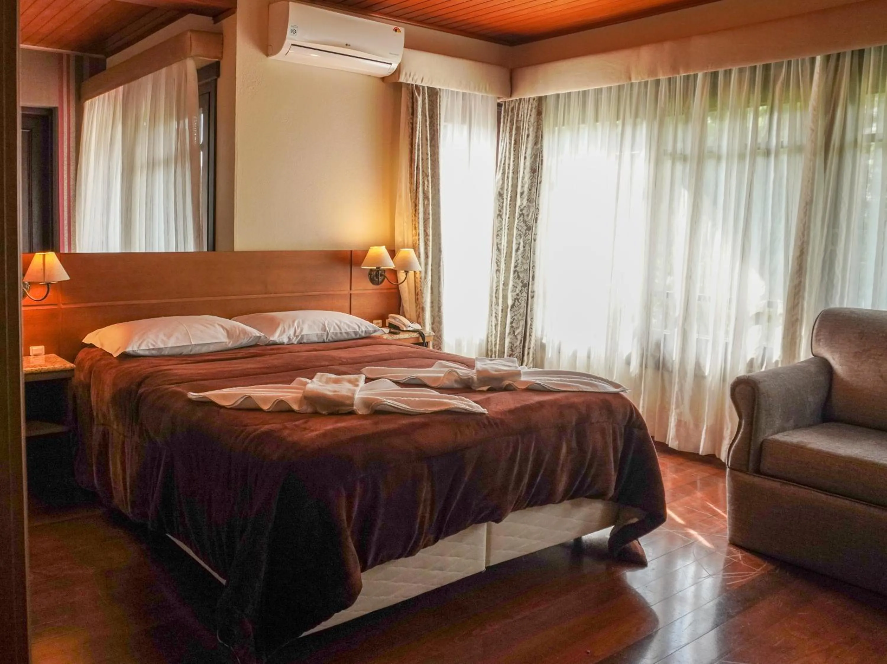 Bed in Pousada Das Papoulas