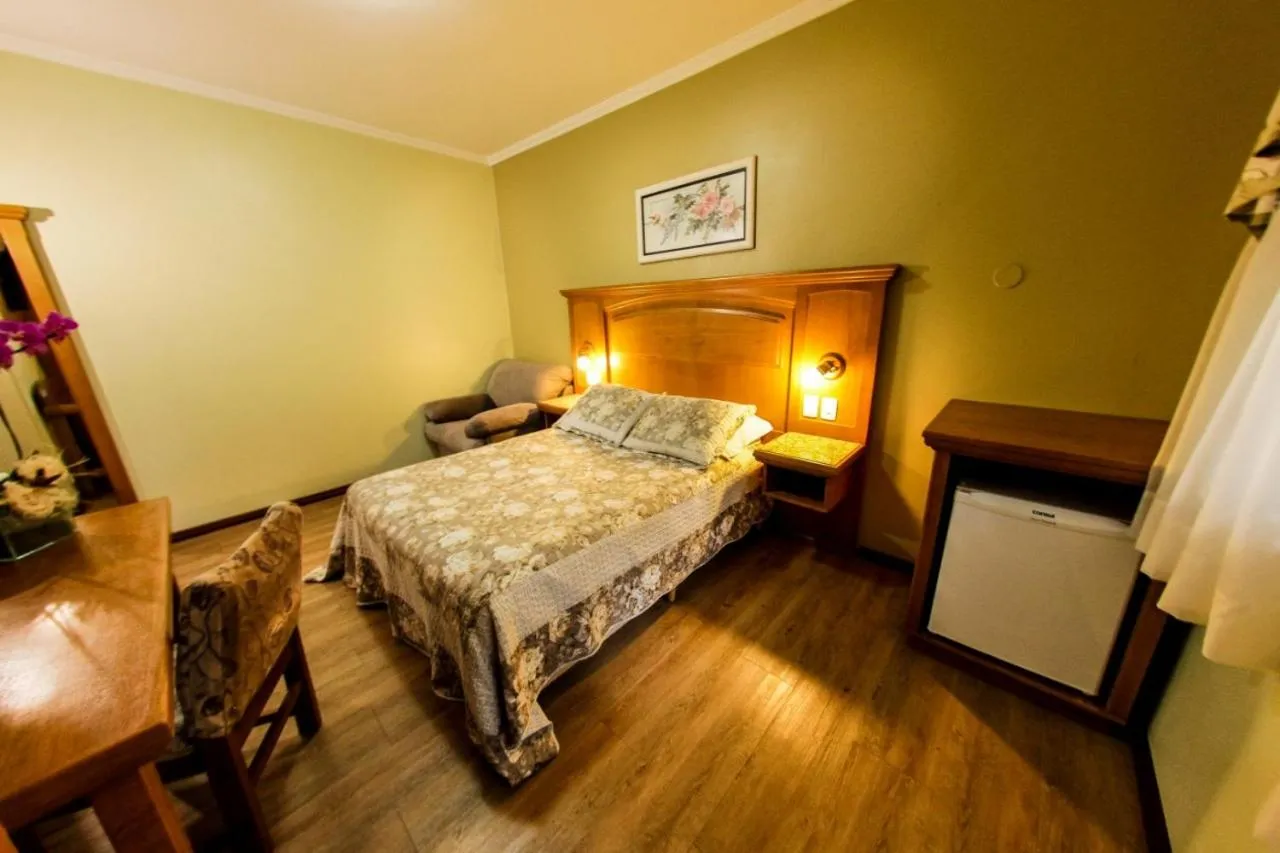 Bed in Pousada Das Papoulas