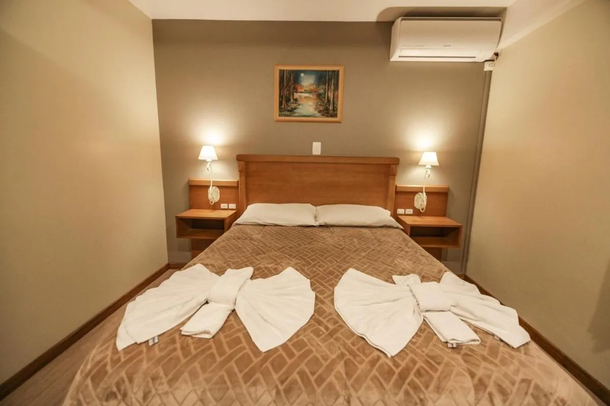 Bed in Pousada Das Papoulas