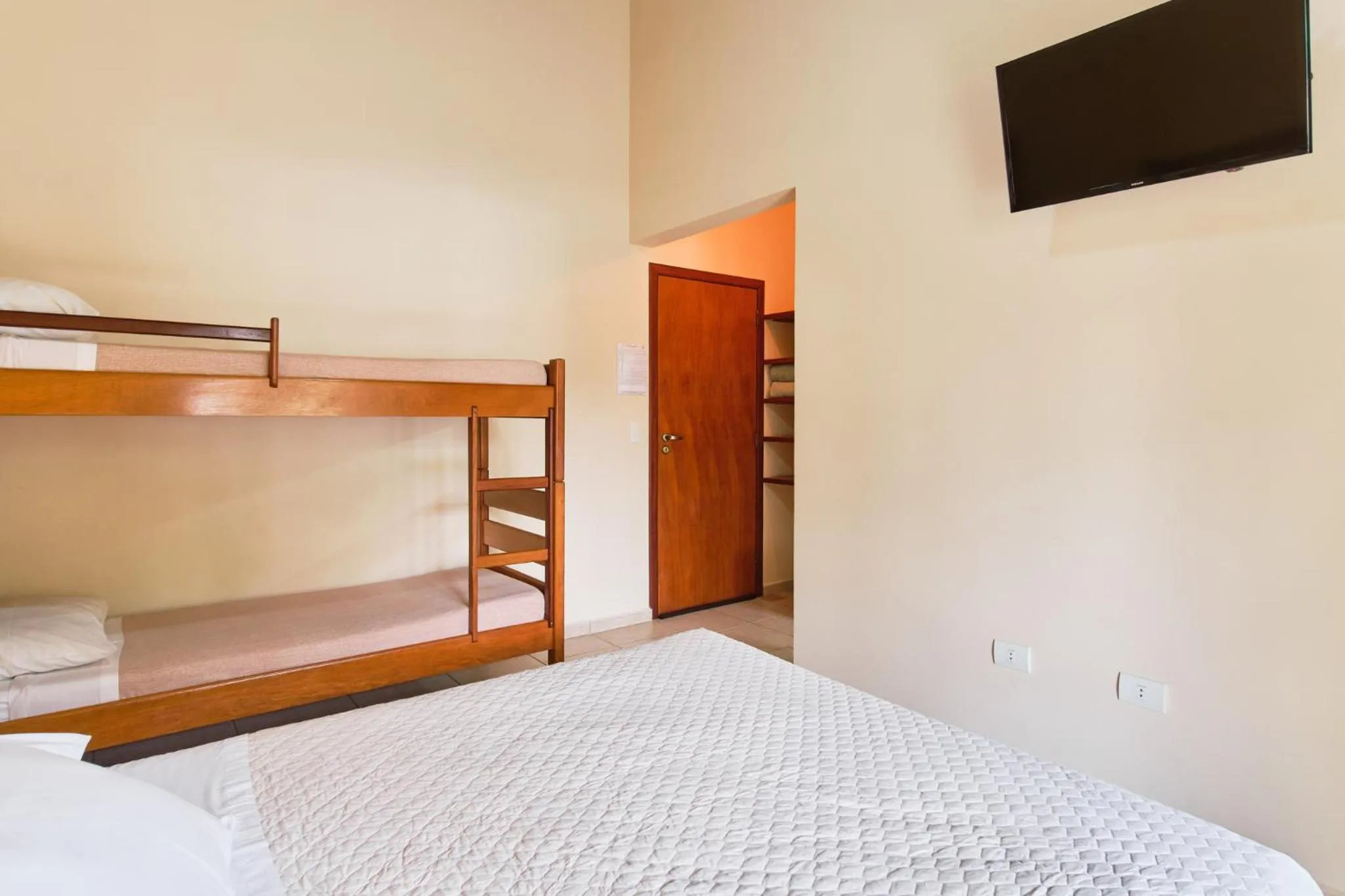 Bed in Pousada Recanto Montecarlo