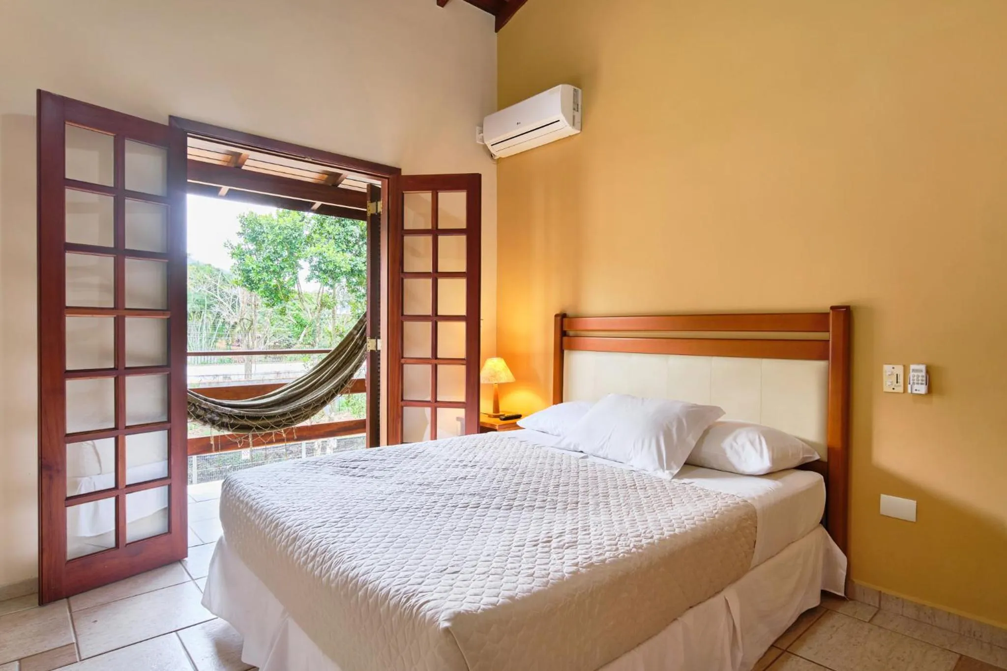 Bed in Pousada Recanto Montecarlo