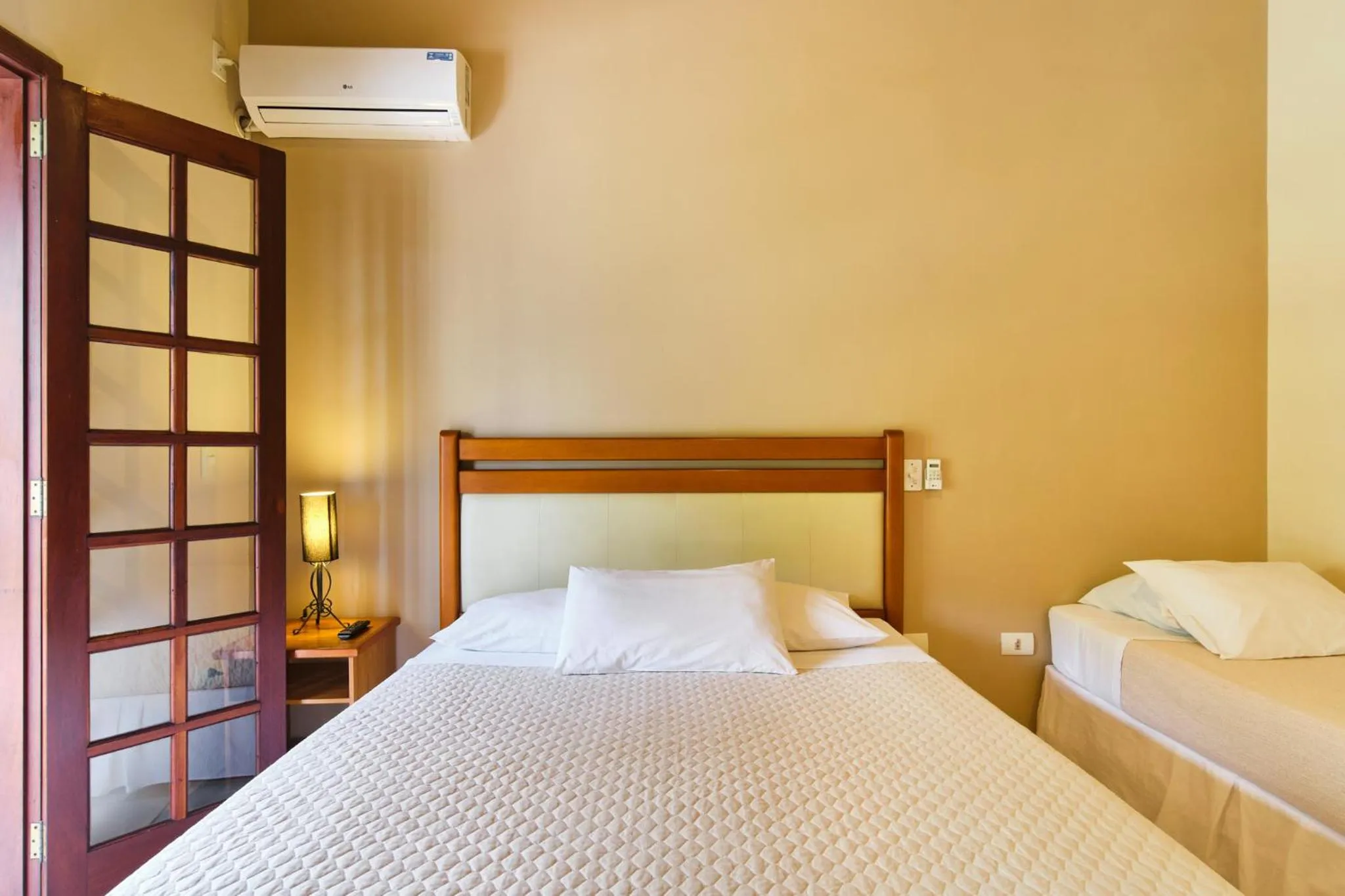 Bed in Pousada Recanto Montecarlo