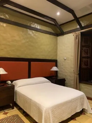 Bedroom, Bed in Hotel 1915 INN & SUITES