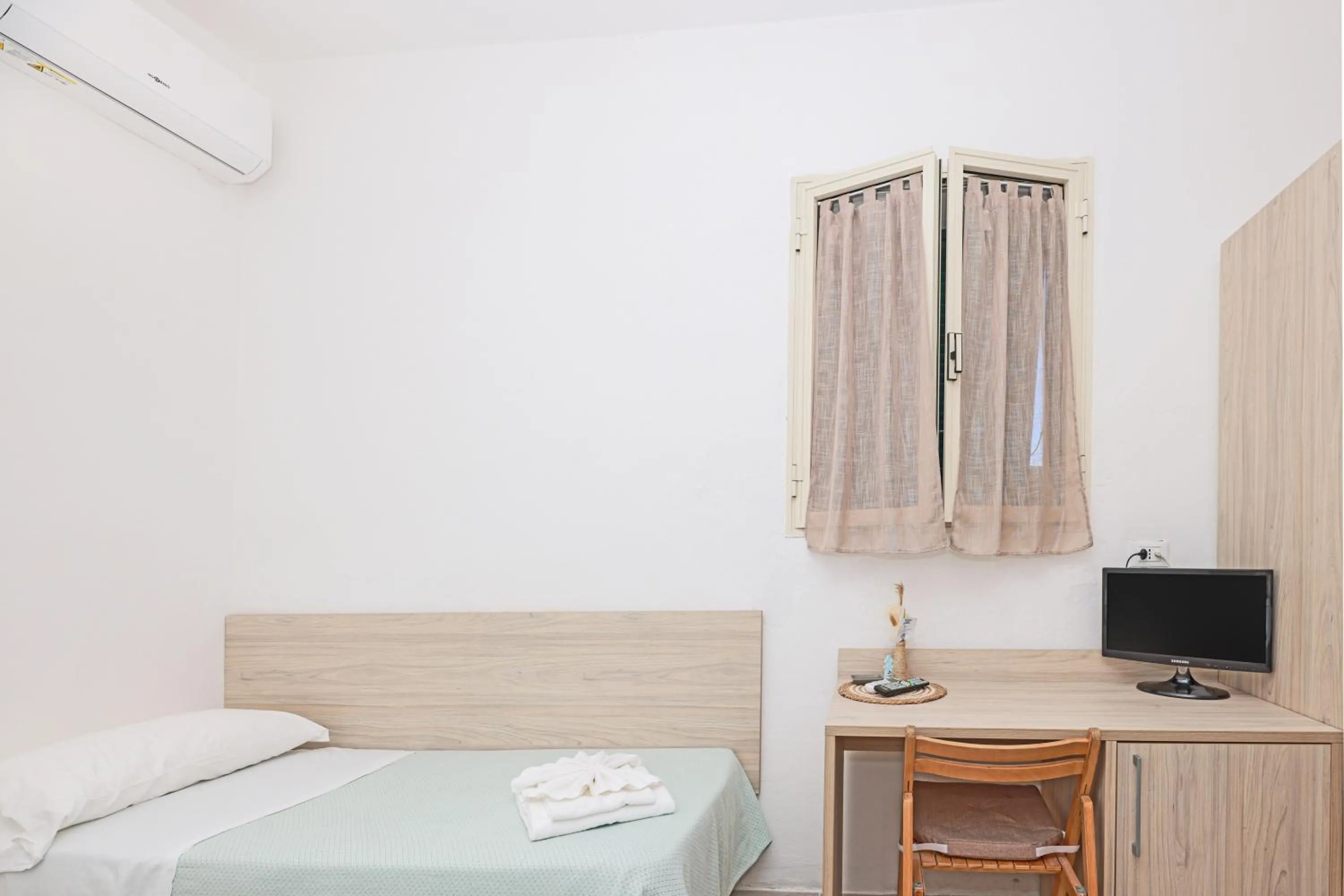 Bed in Hotel Le Ghiaie