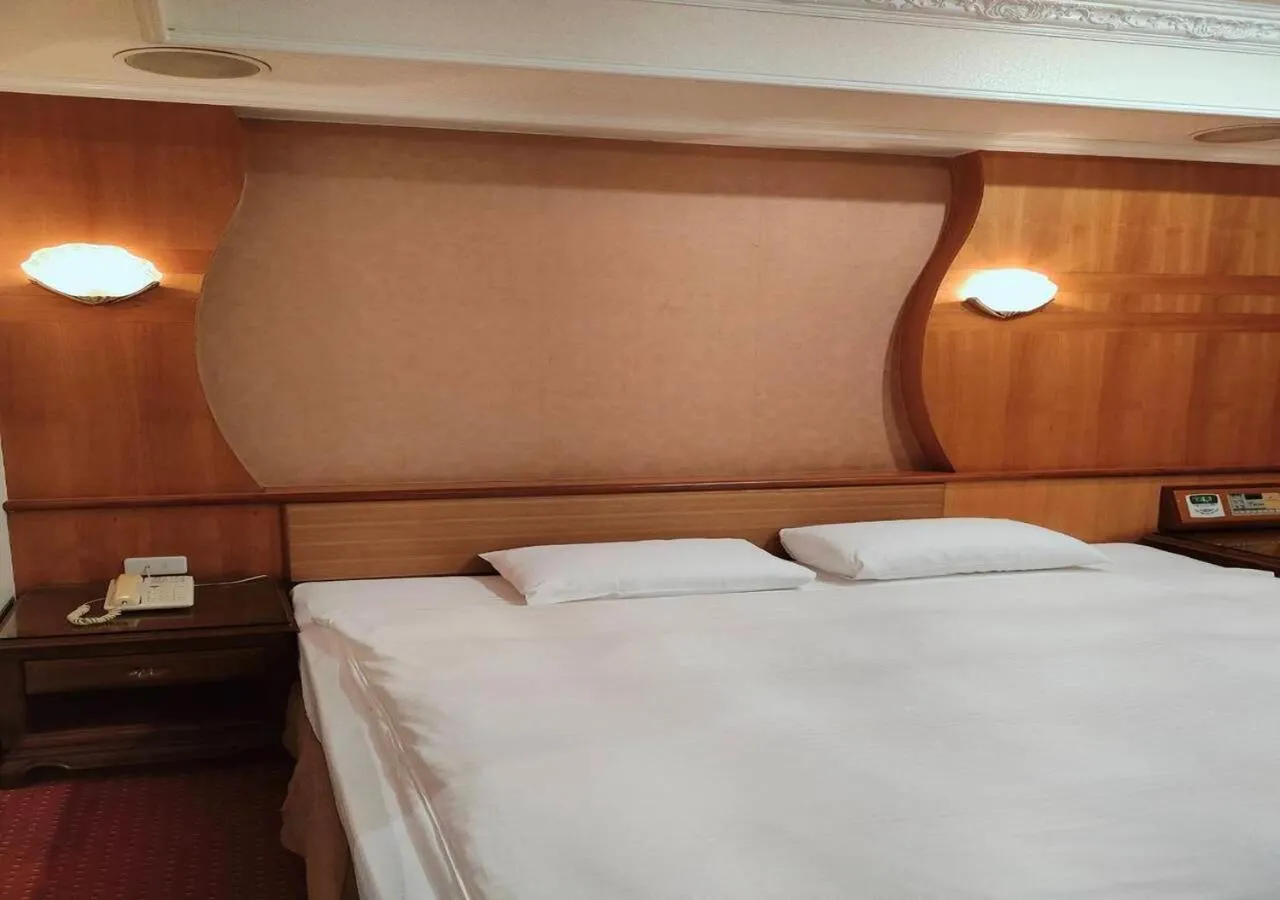 Bed in Champion Hotel