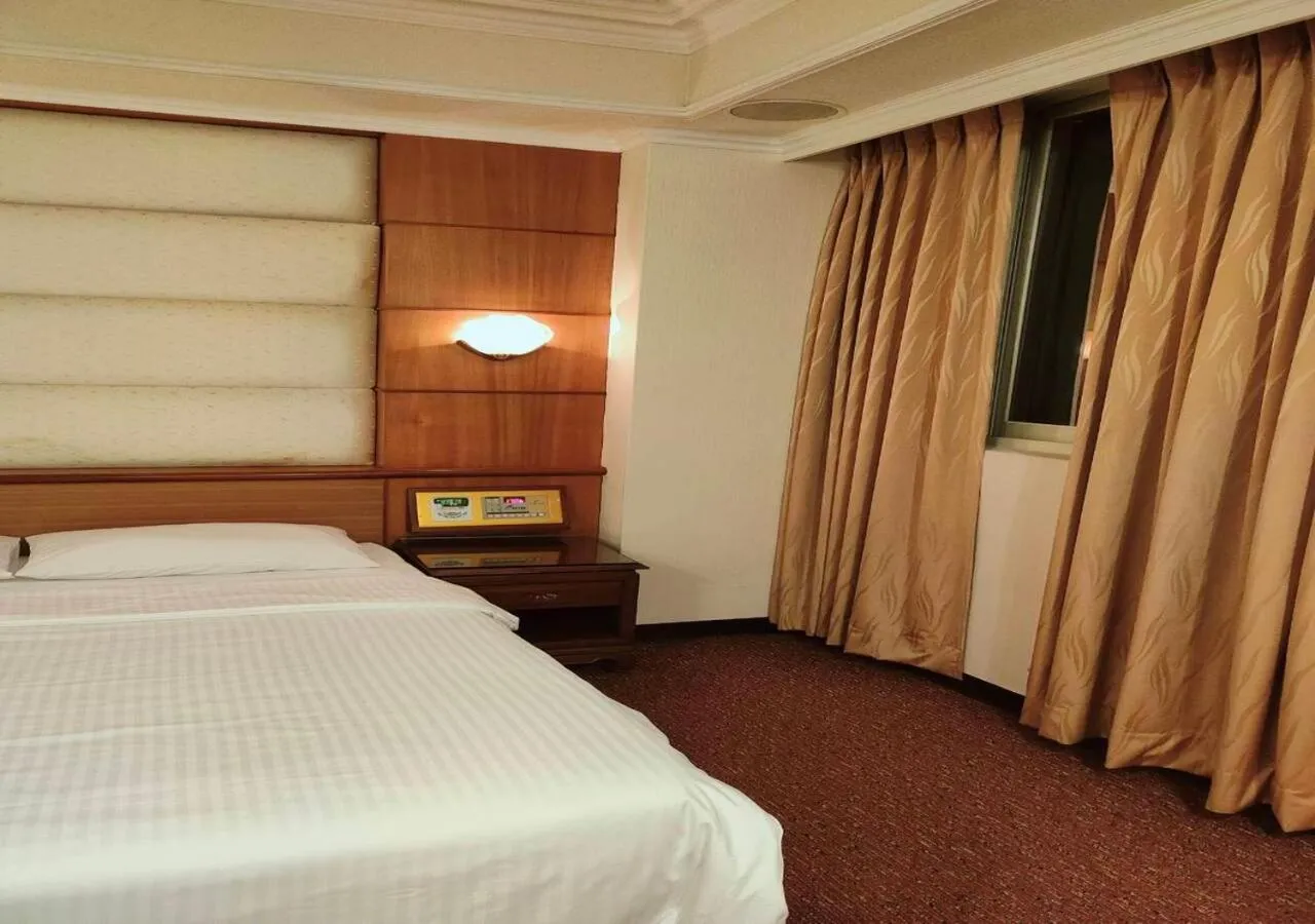 Bed in Champion Hotel