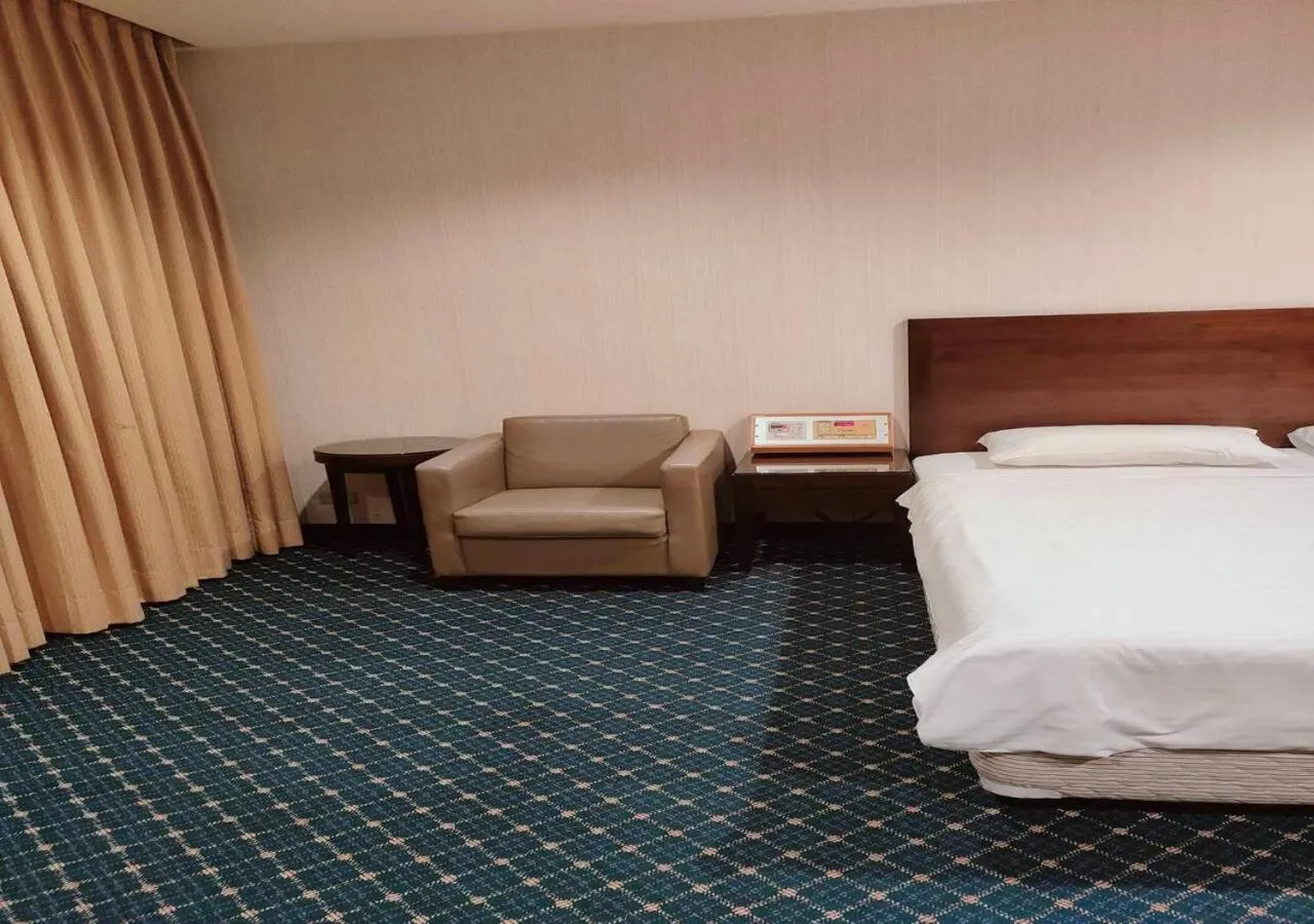 Bed in Champion Hotel