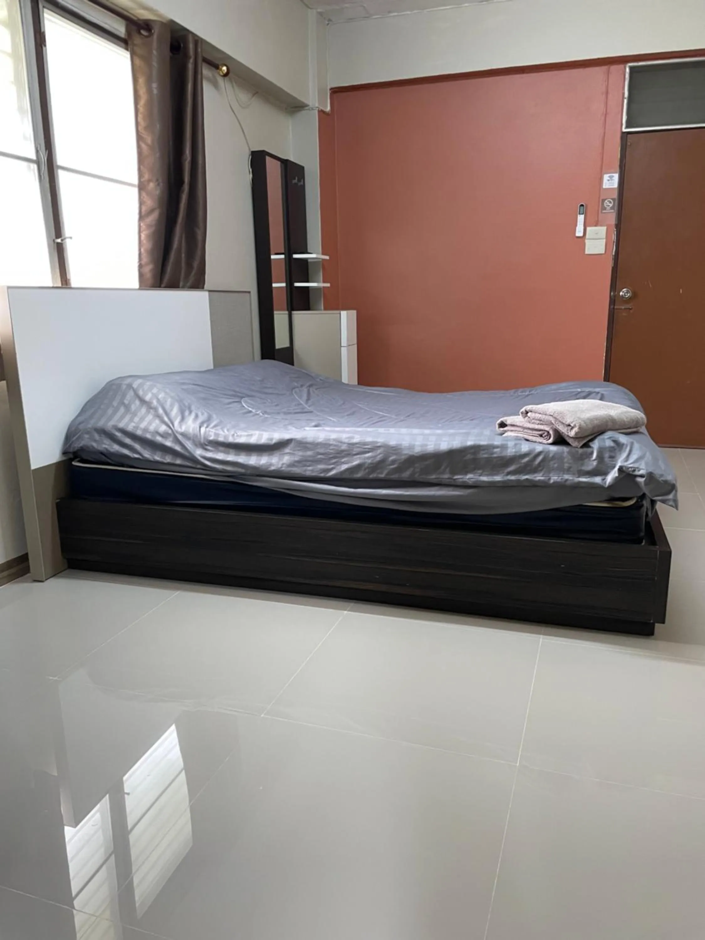 Bed in Gedkanok Apartment