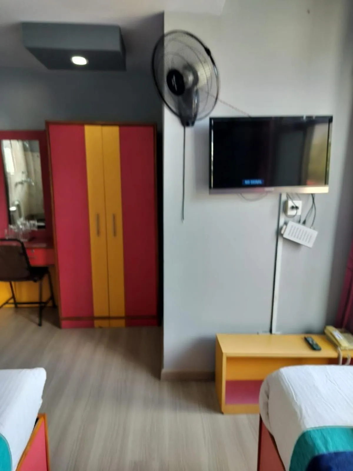 Bed in Three Brothers Apartment and Hotel