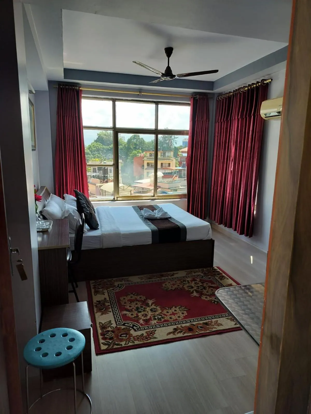 Bed in Three Brothers Apartment and Hotel