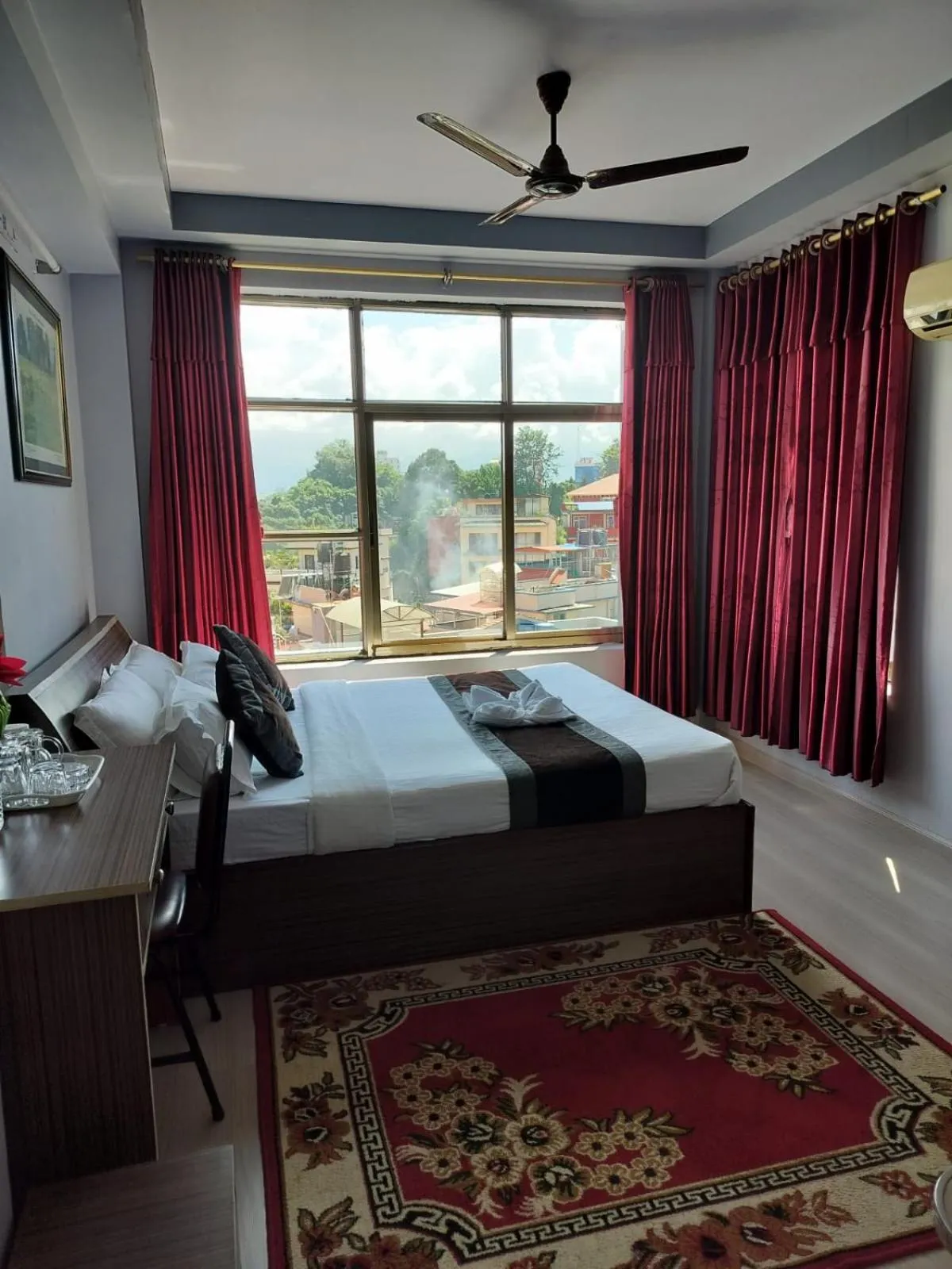 Bed in Three Brothers Apartment and Hotel