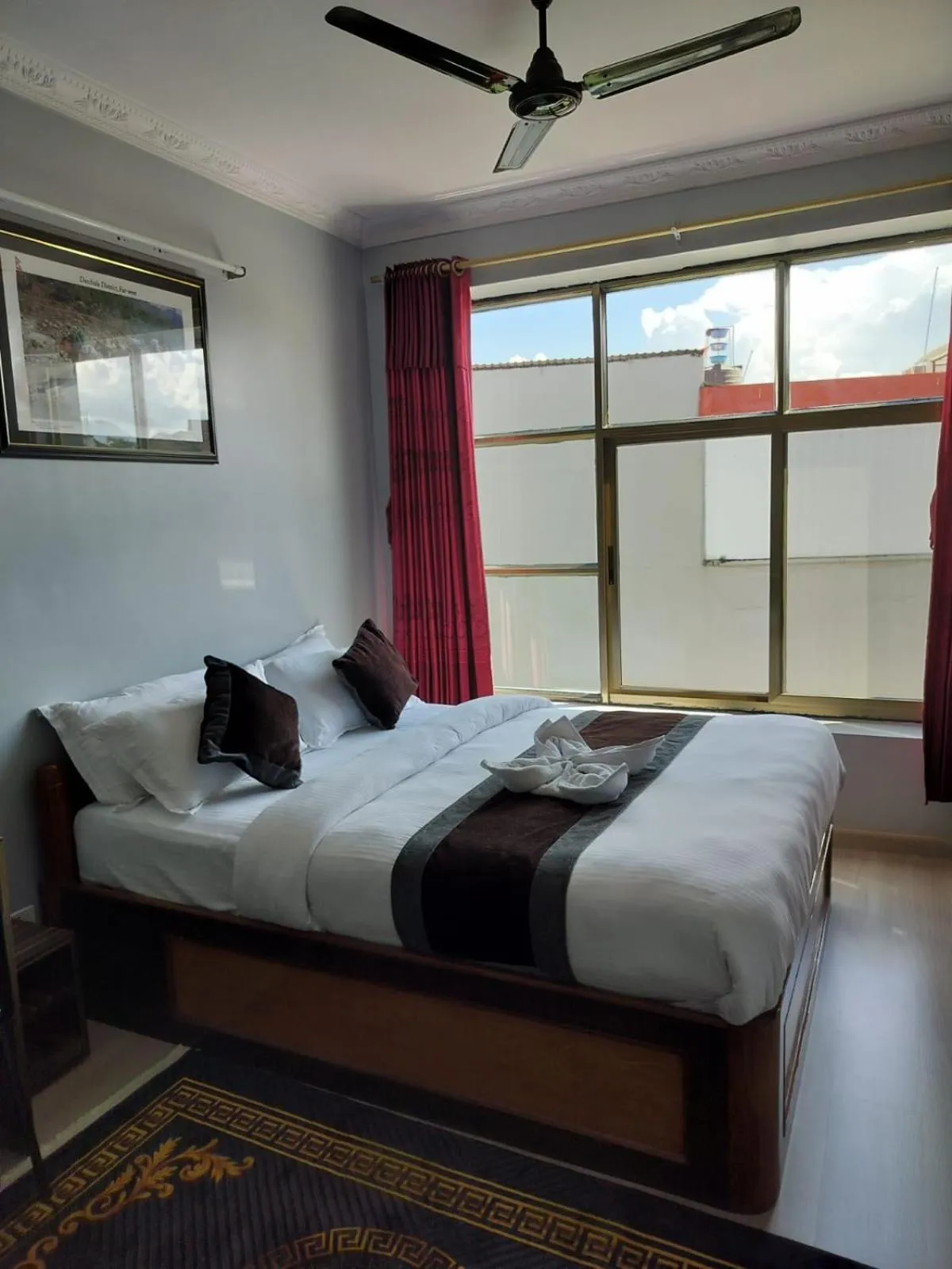 Bed in Three Brothers Apartment and Hotel