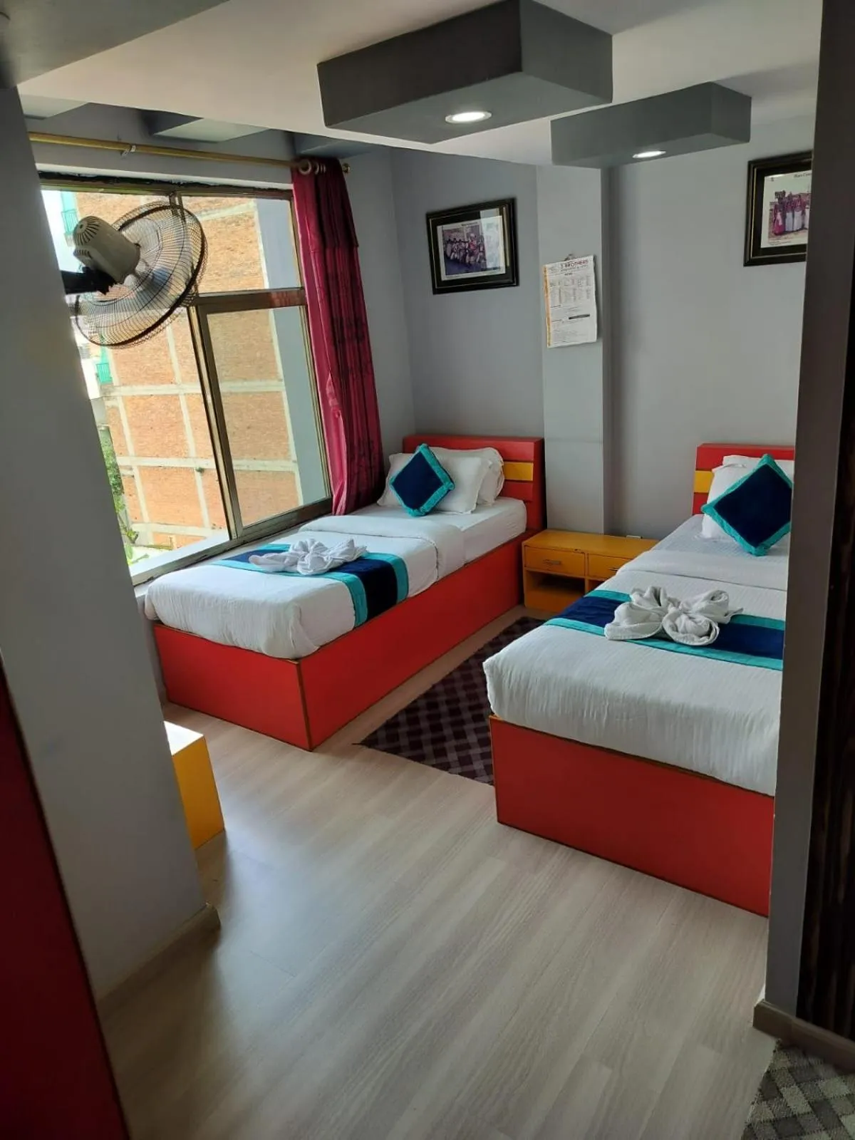 Bed in Three Brothers Apartment and Hotel