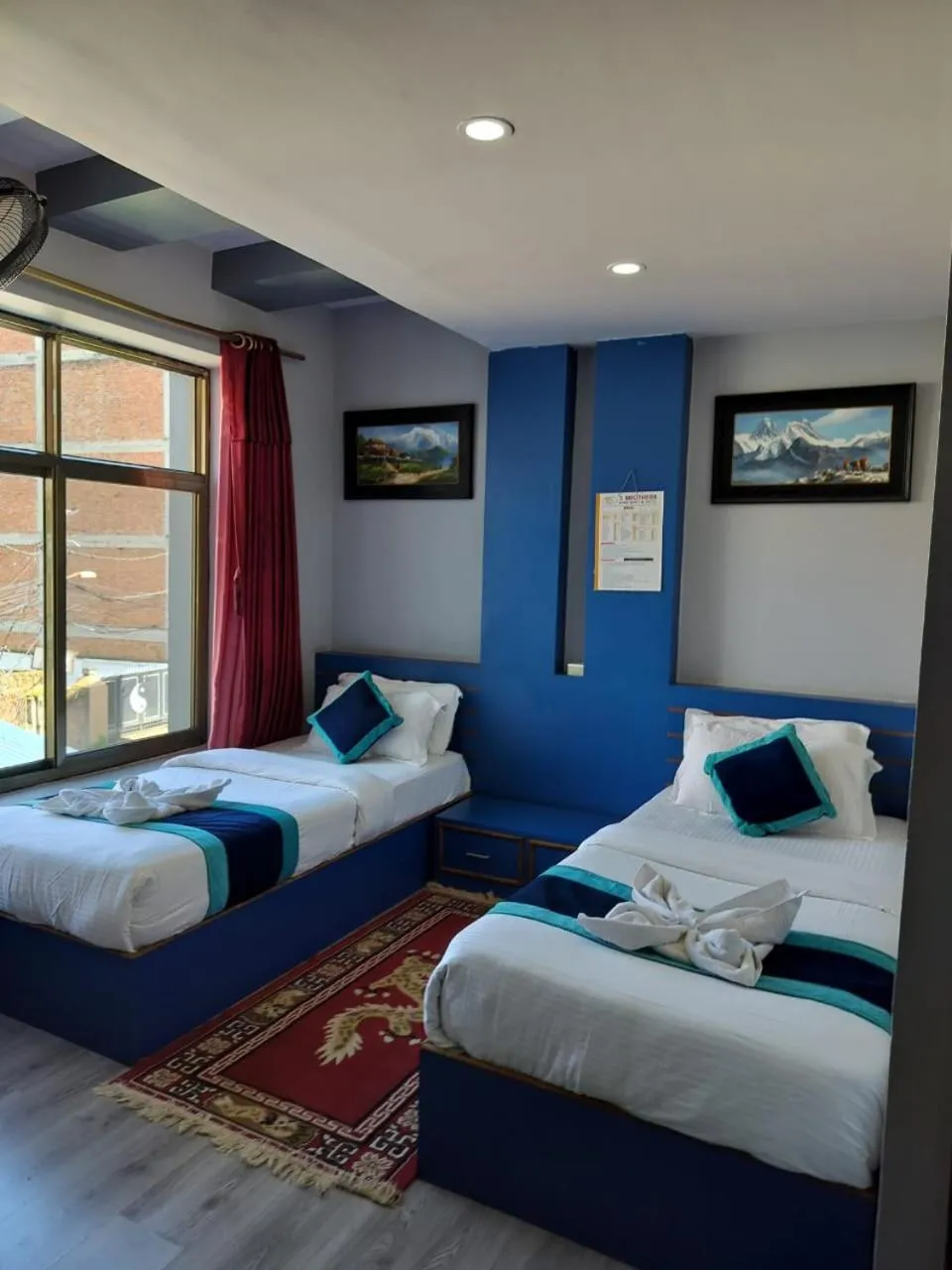 Bed in Three Brothers Apartment and Hotel