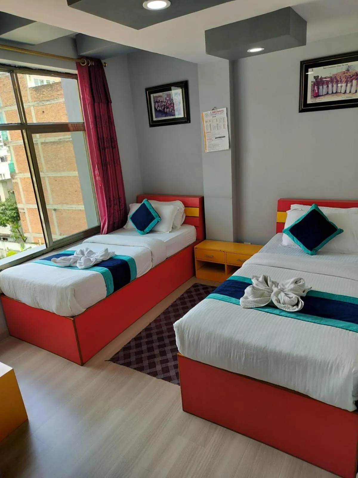 Bed in Three Brothers Apartment and Hotel