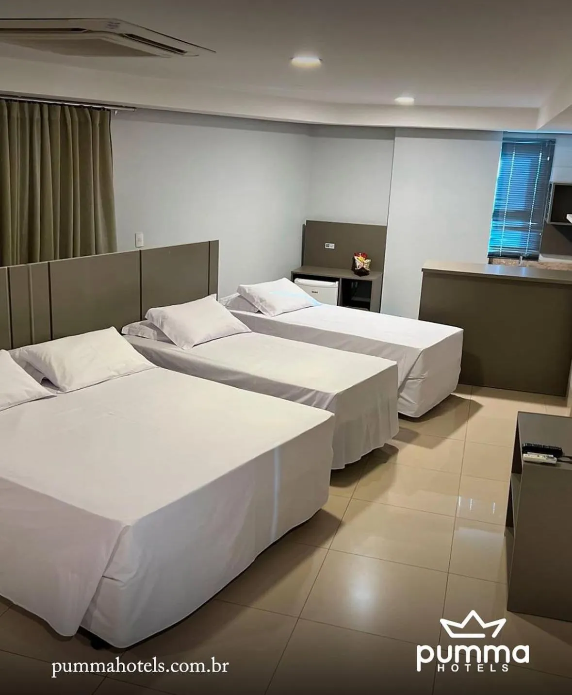 Bed in Pumma Business Hotel