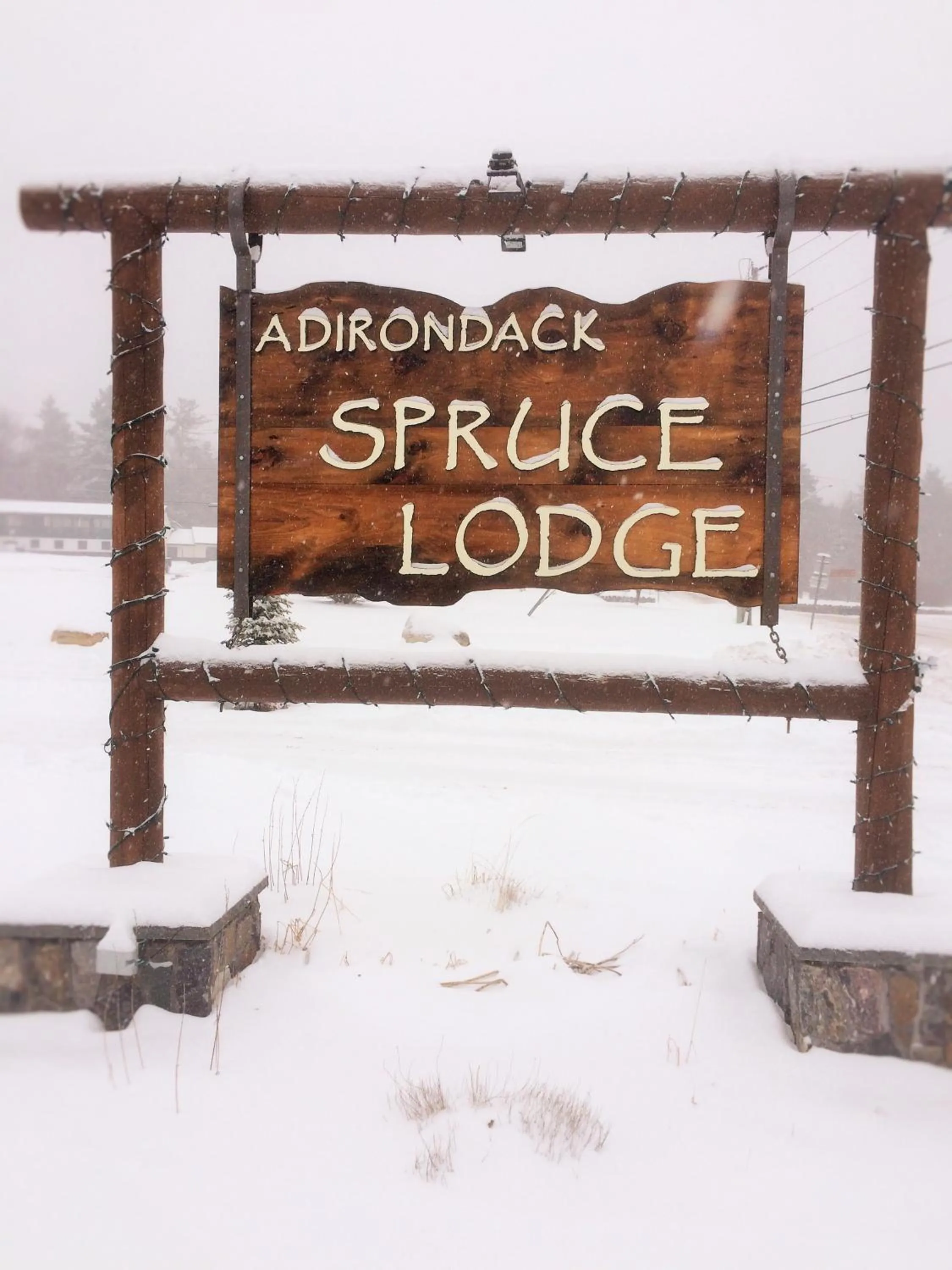 Property logo or sign in Adirondack Spruce Lodge