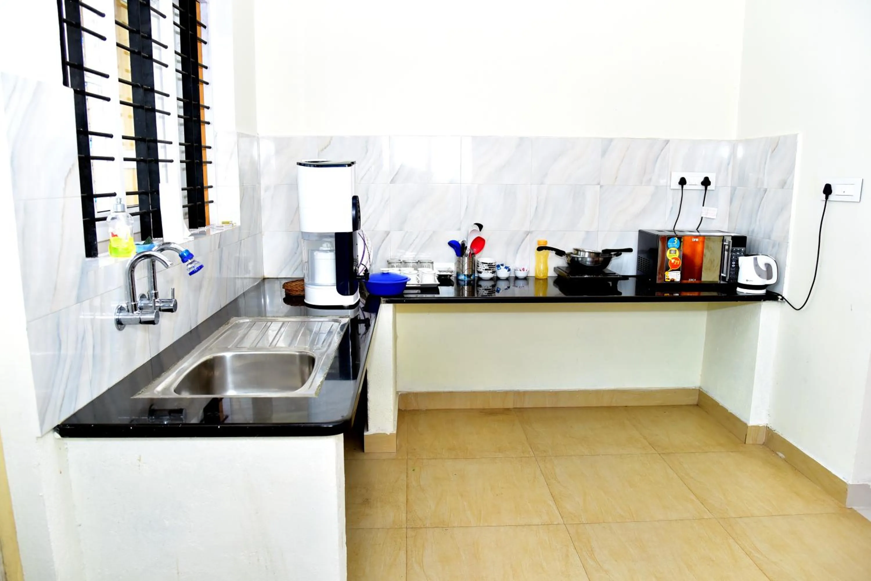 Kitchen or kitchenette in Holidayincoorg Orchid Villa