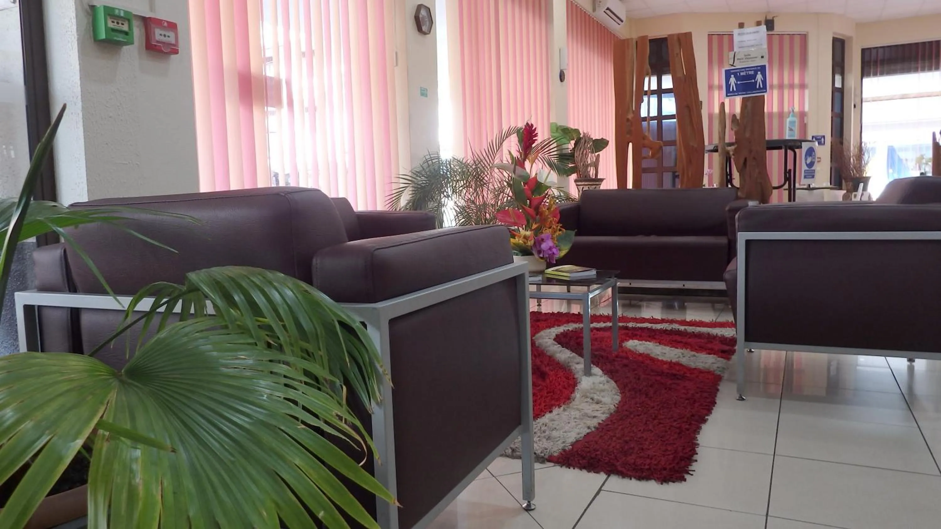 Communal lounge/ TV room in Central Hotel Cayenne