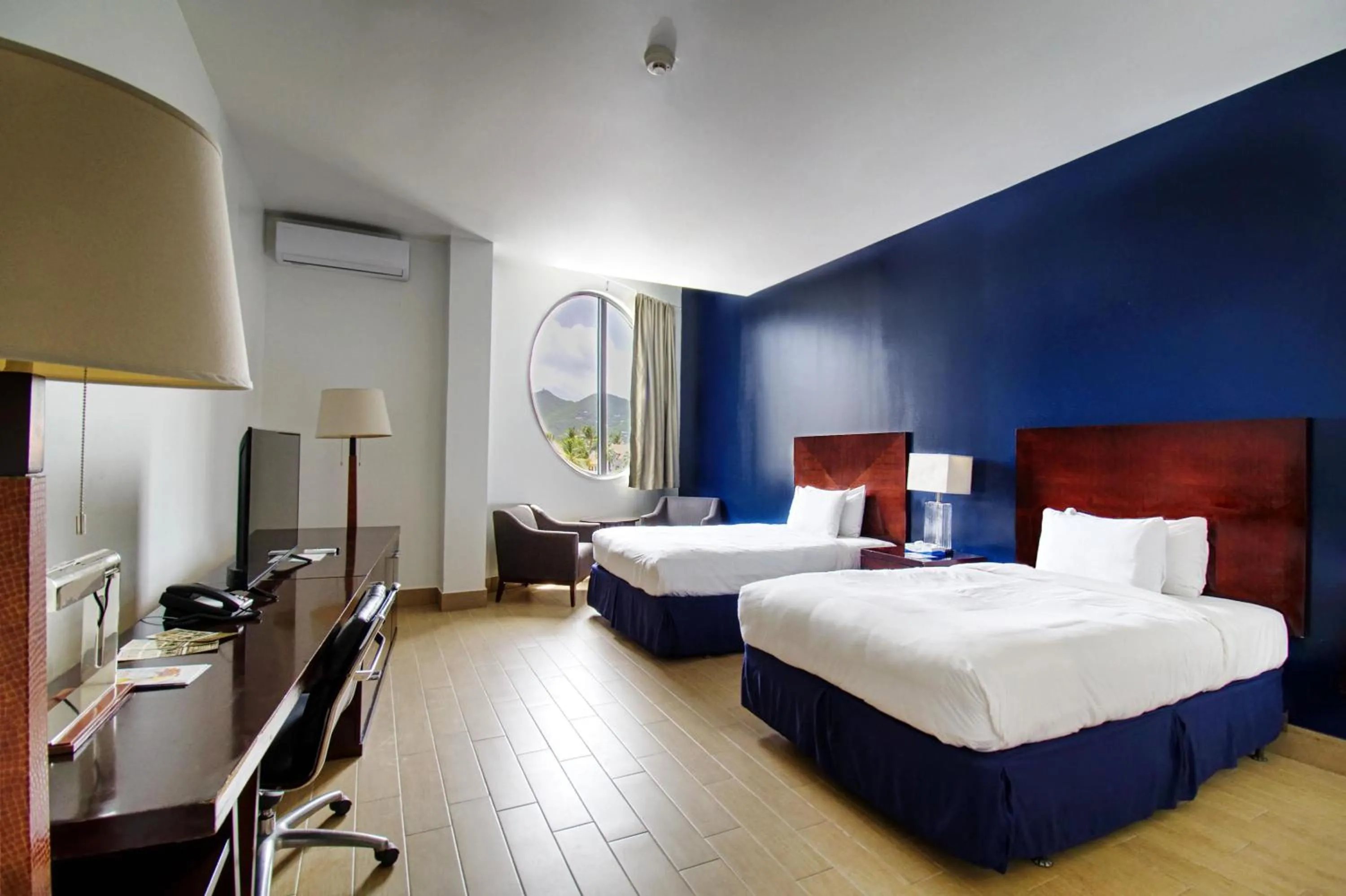 Bedroom, Bed in Commodore Suites, SureStay Collection by Best Western