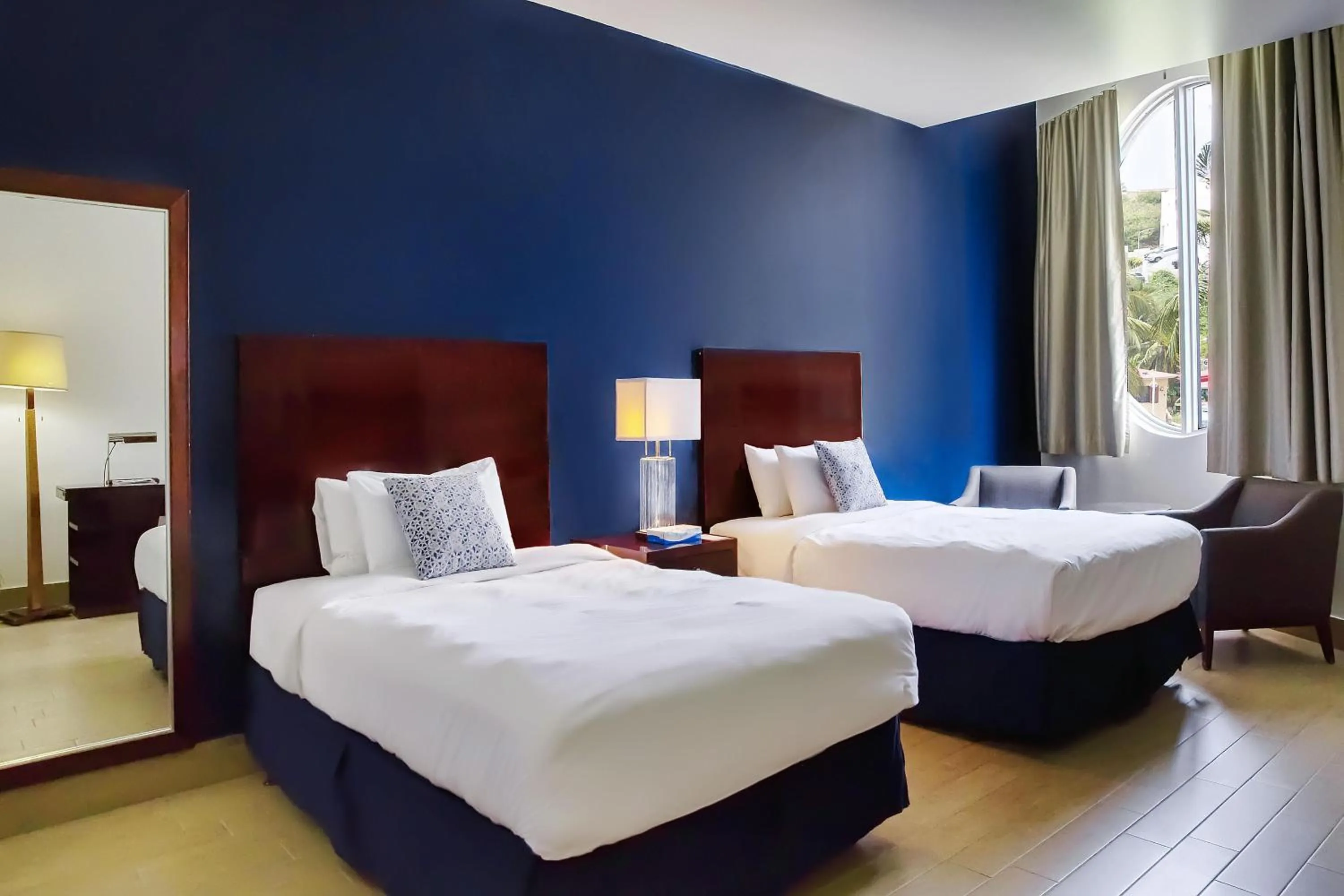 Bedroom, Bed in Commodore Suites, SureStay Collection by Best Western