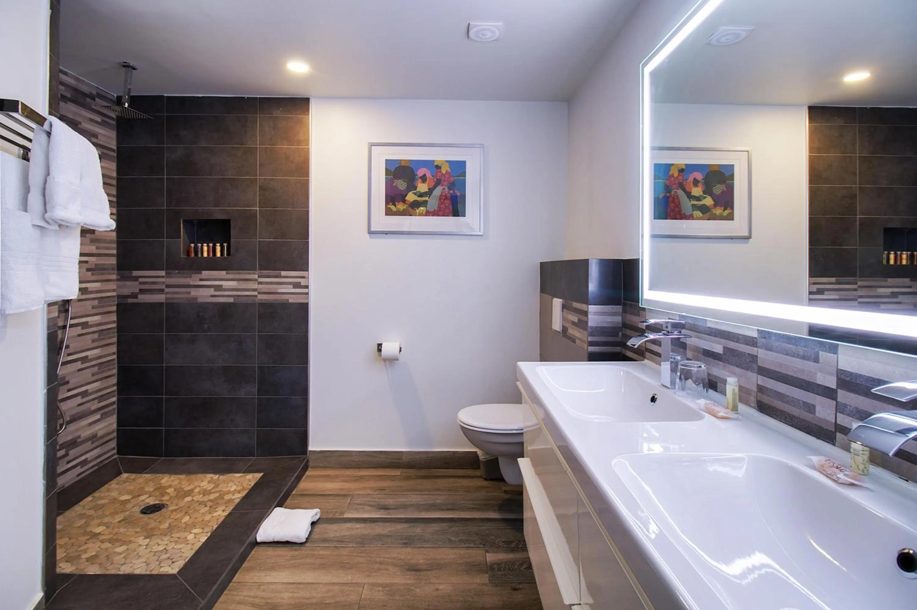 Bathroom in Commodore Suites, SureStay Collection by Best Western