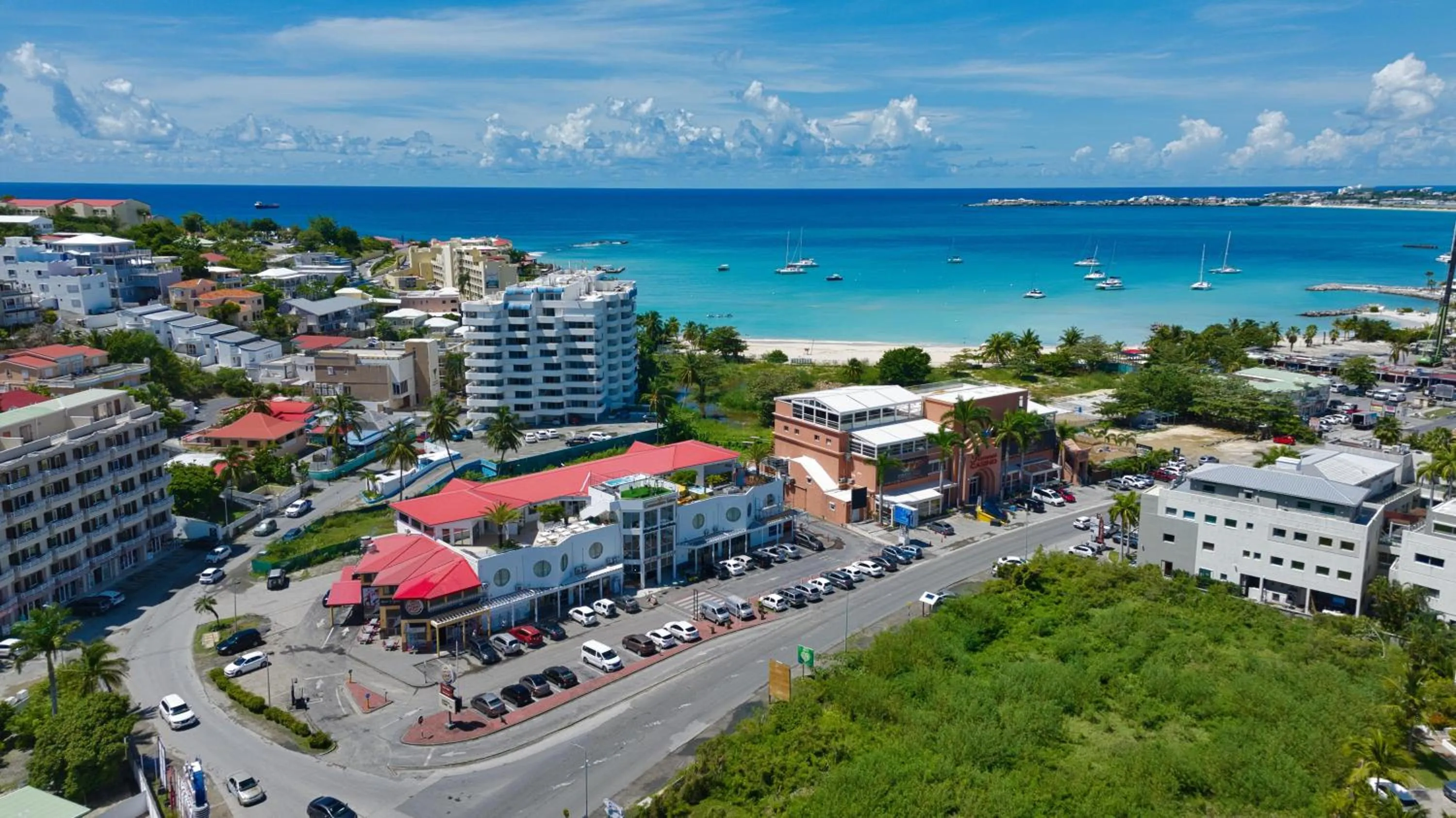 Property building in Commodore Suites, SureStay Collection by Best Western