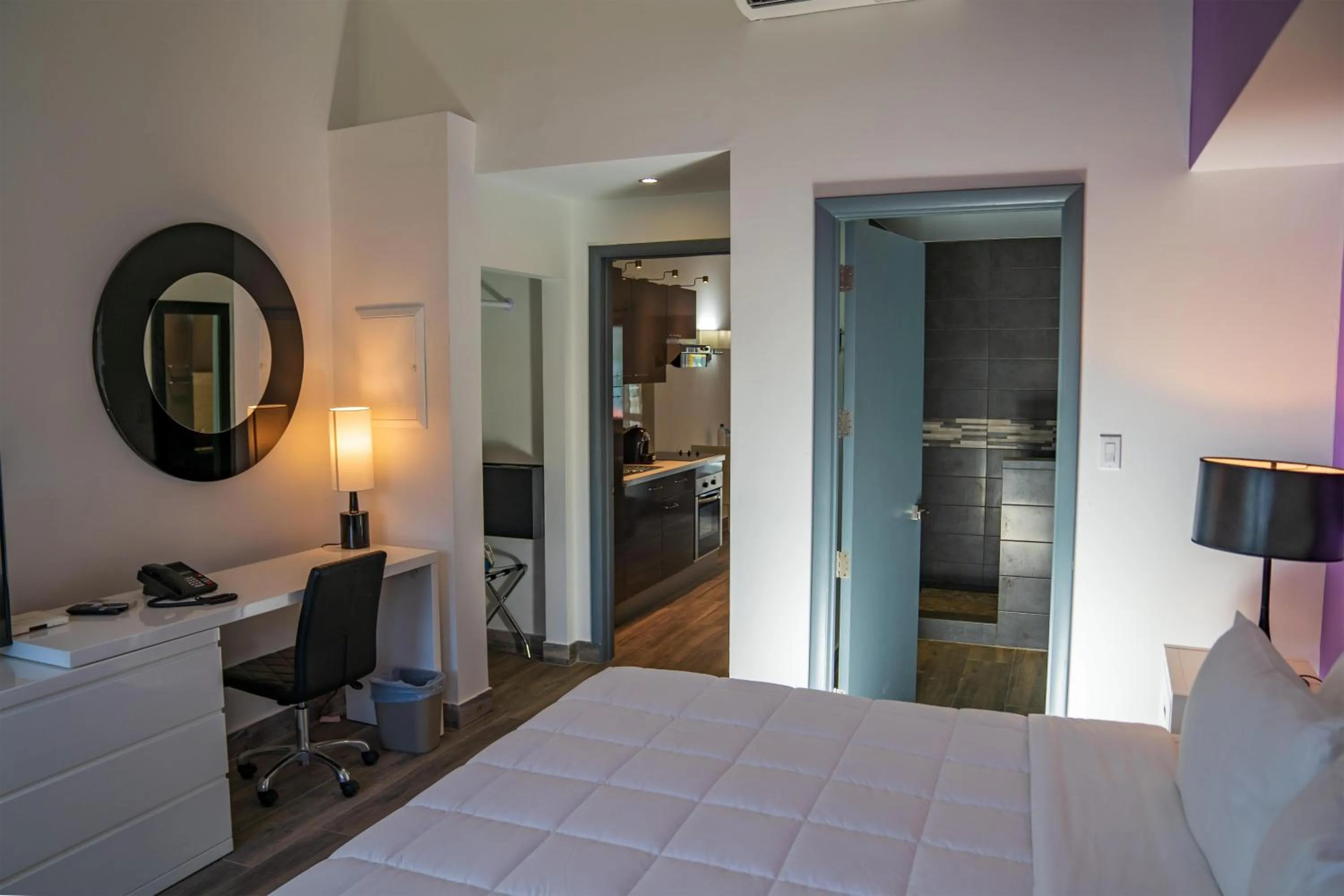 Bedroom, Bed in Commodore Suites, SureStay Collection by Best Western