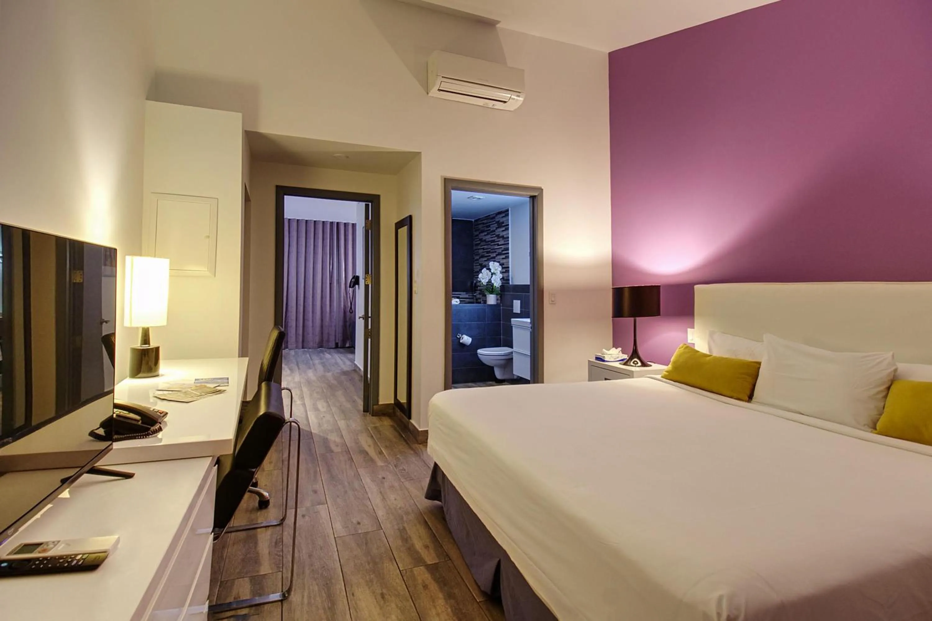 Bedroom, Bed in Commodore Suites, SureStay Collection by Best Western