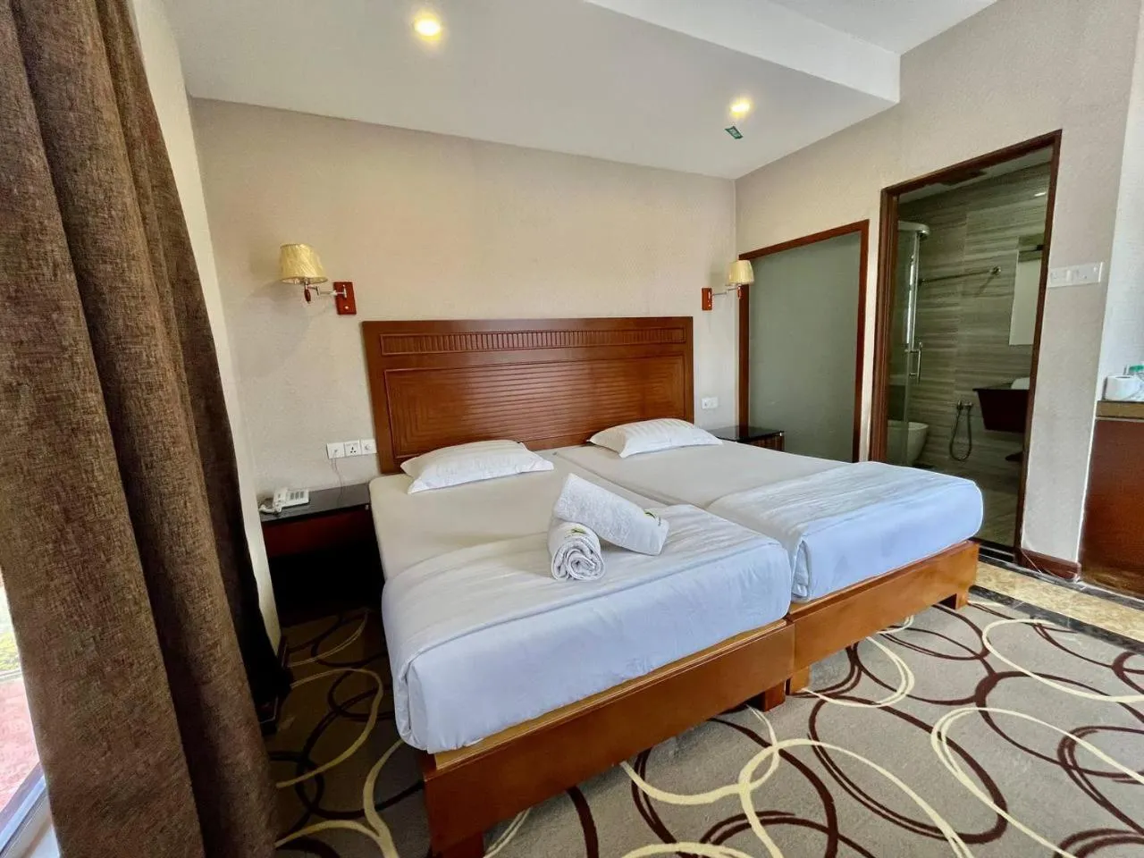 Bed in Fan Holiday Hotel