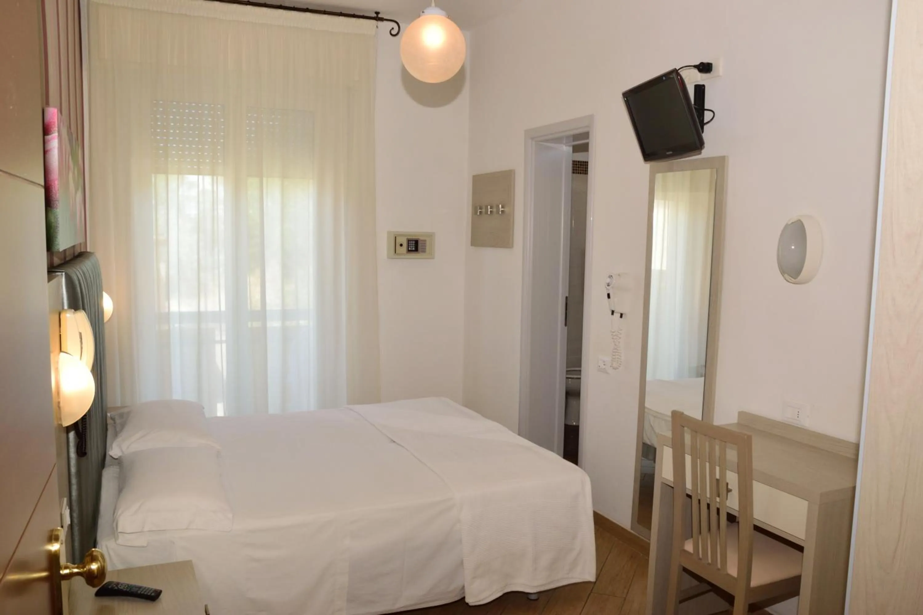 Bedroom in Hotel La Capinera