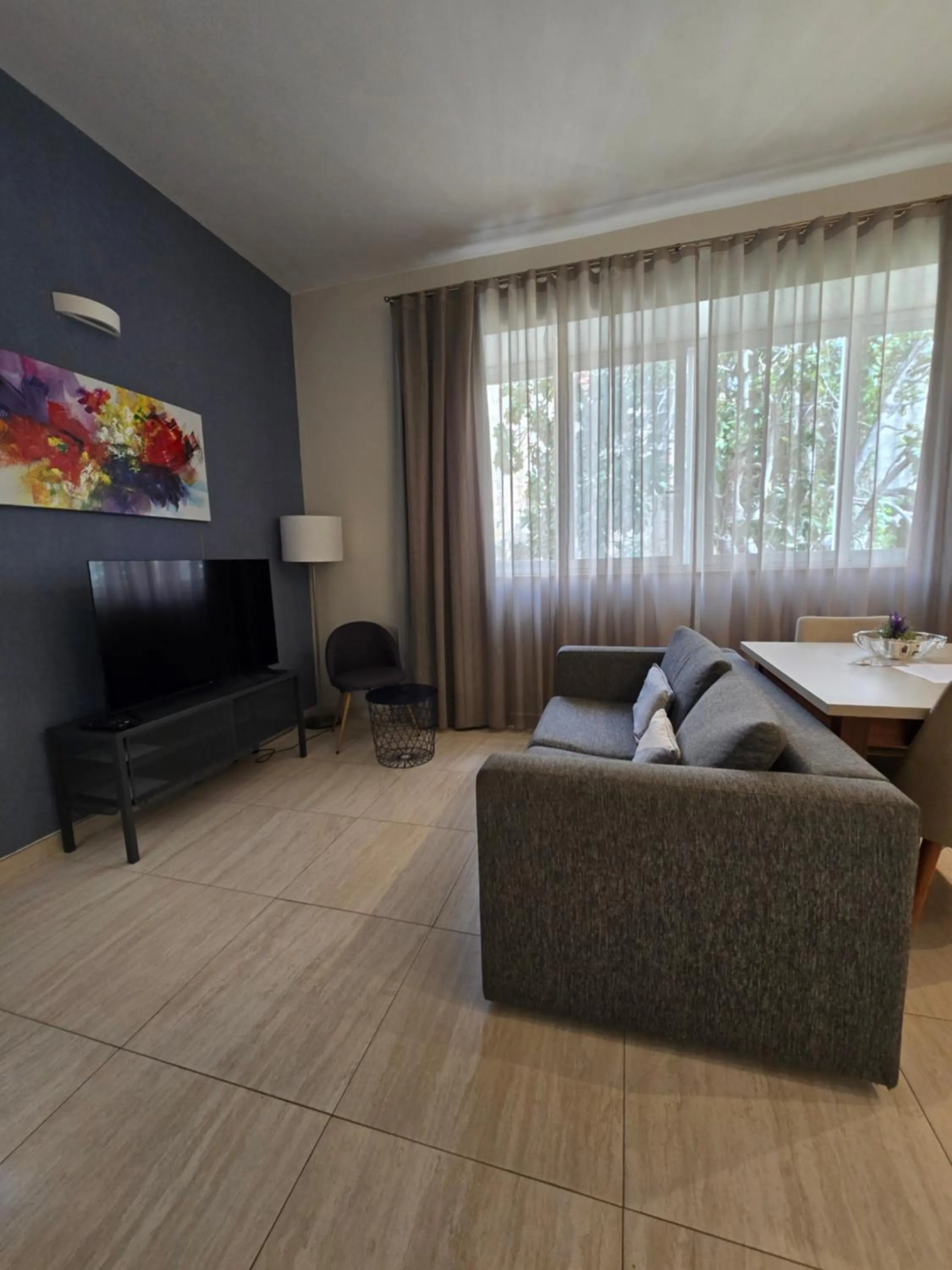 TV and multimedia in D Townhouse Boutique Suites